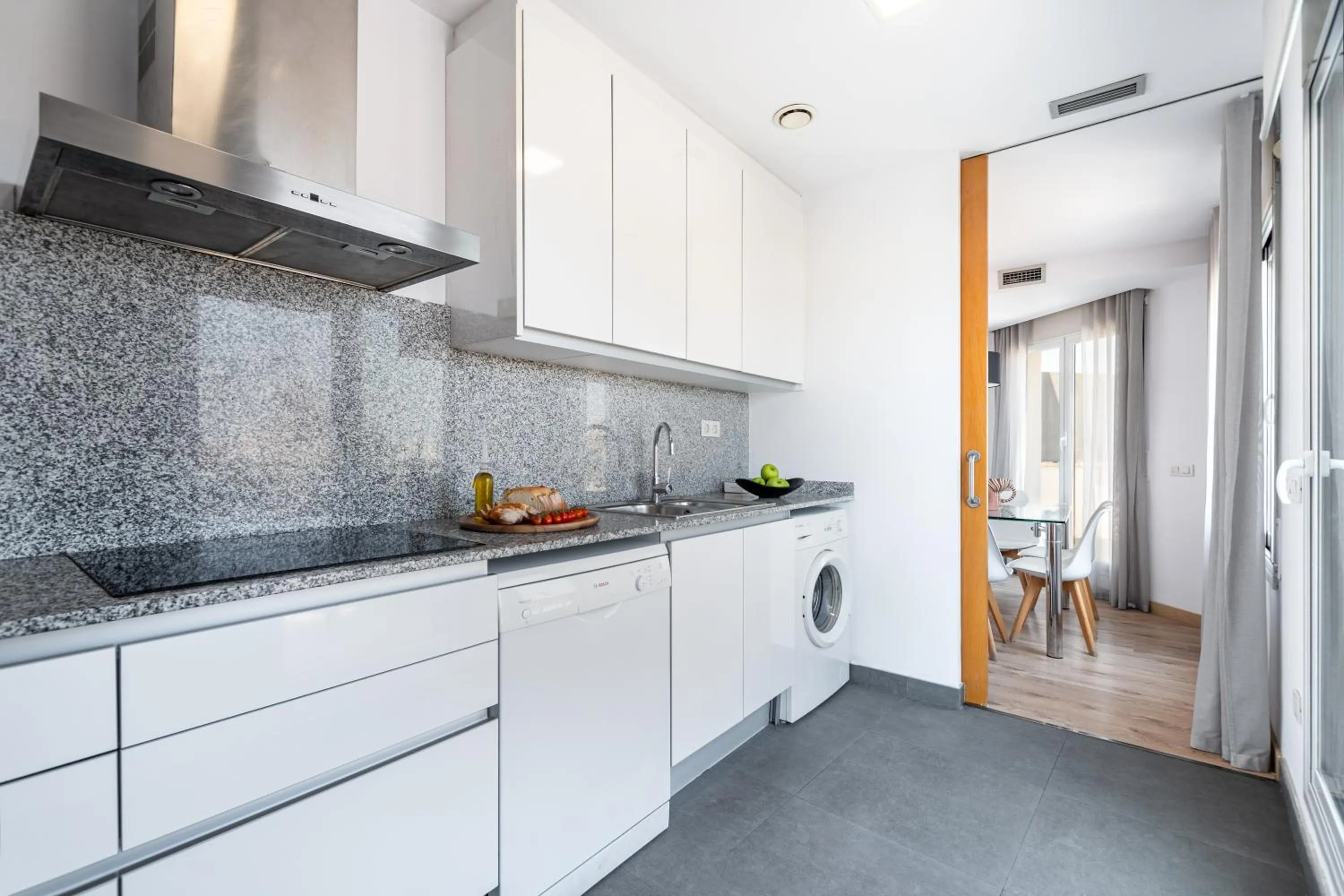 Kitchen or kitchenette in The Corner Apartments by Aspasios