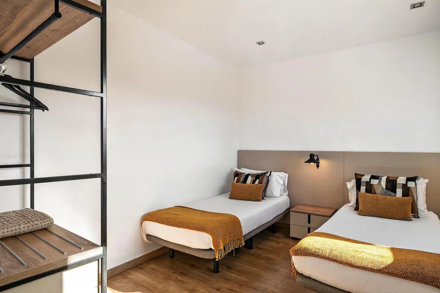 Bedroom, Bed in The Corner Apartments by Aspasios