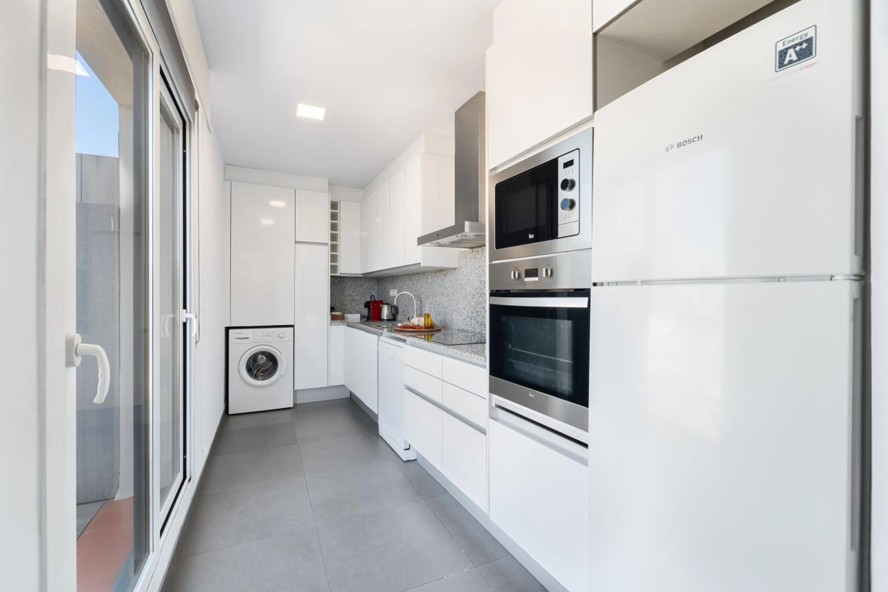 Kitchen or kitchenette in The Corner Apartments by Aspasios