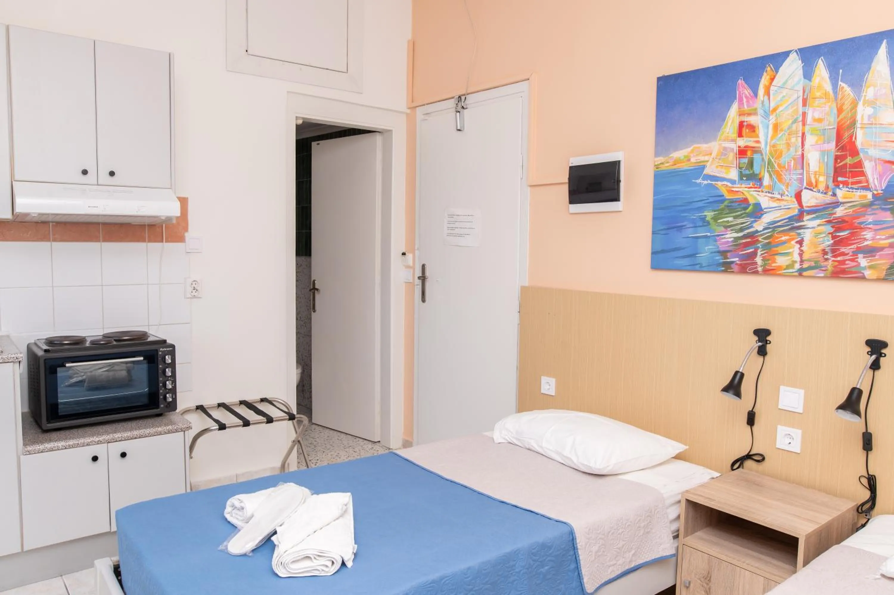 Bed in Achilleas Hotel Apartments