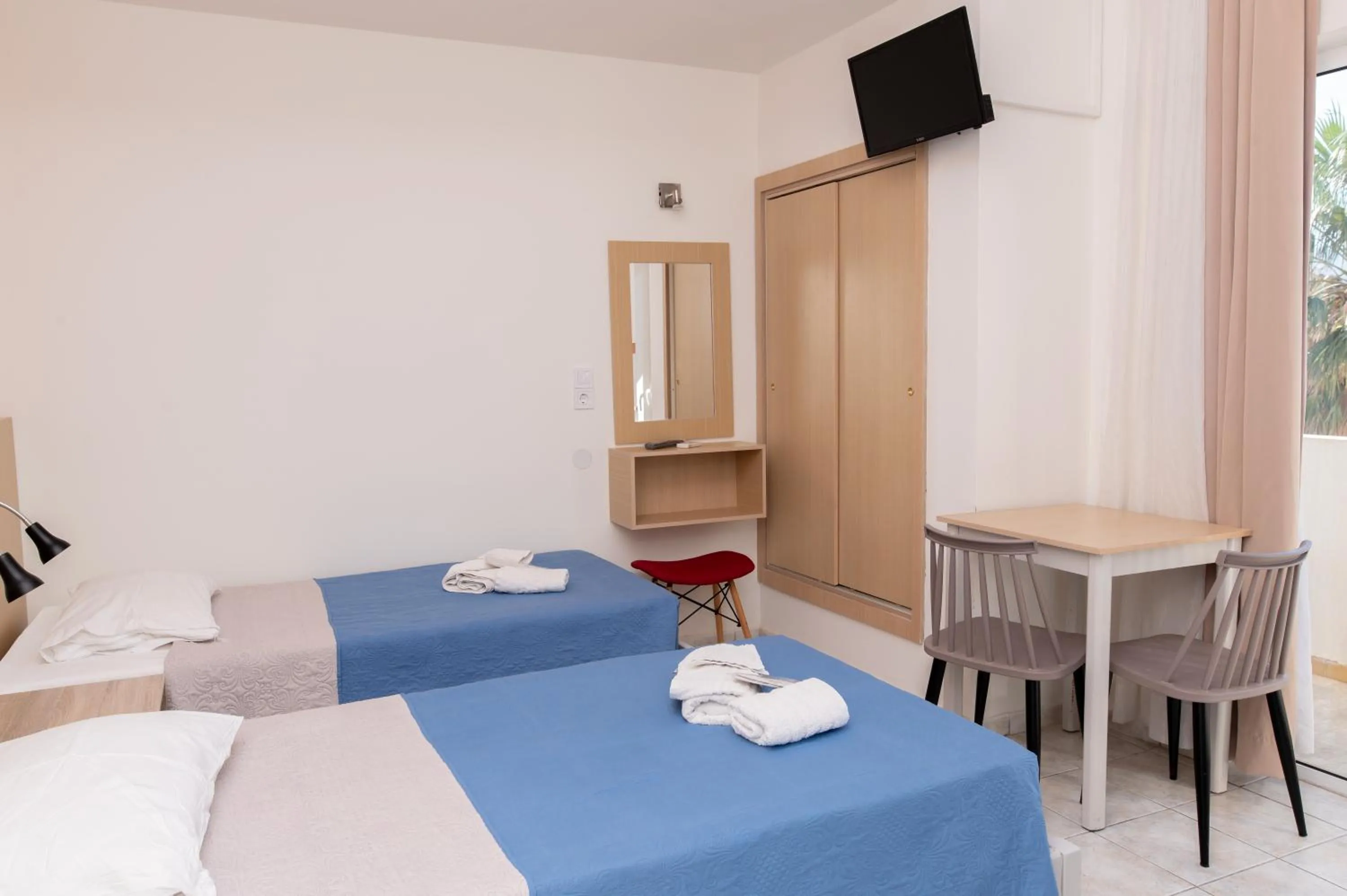 Bed in Achilleas Hotel Apartments