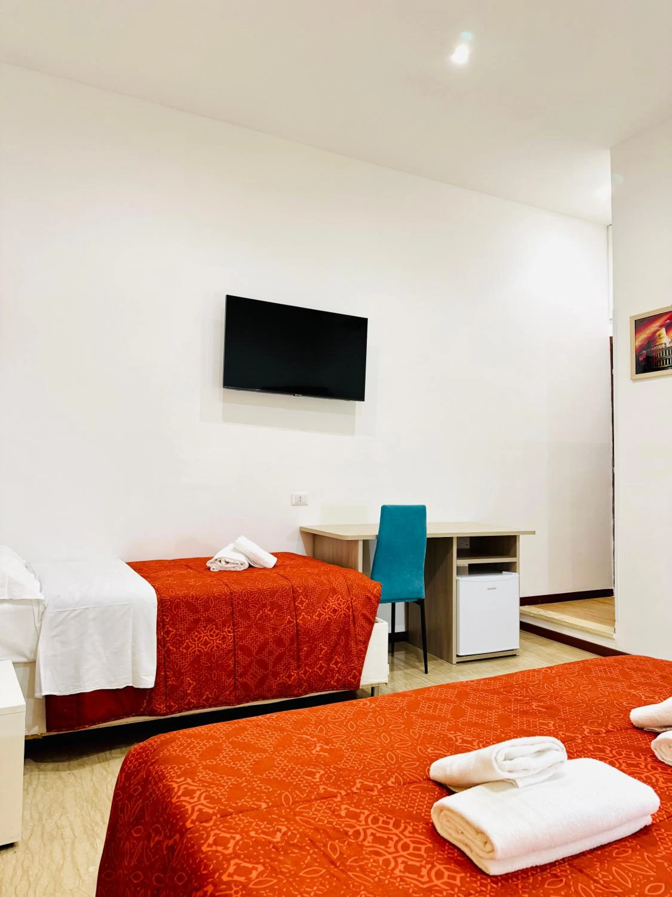 Communal lounge/ TV room, Bed in Tawhid Accomodation