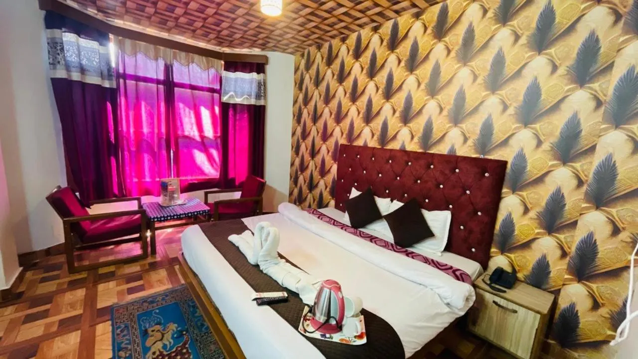 Bed in Hotel Hilltop At Mall Road Manali With Open Terrace