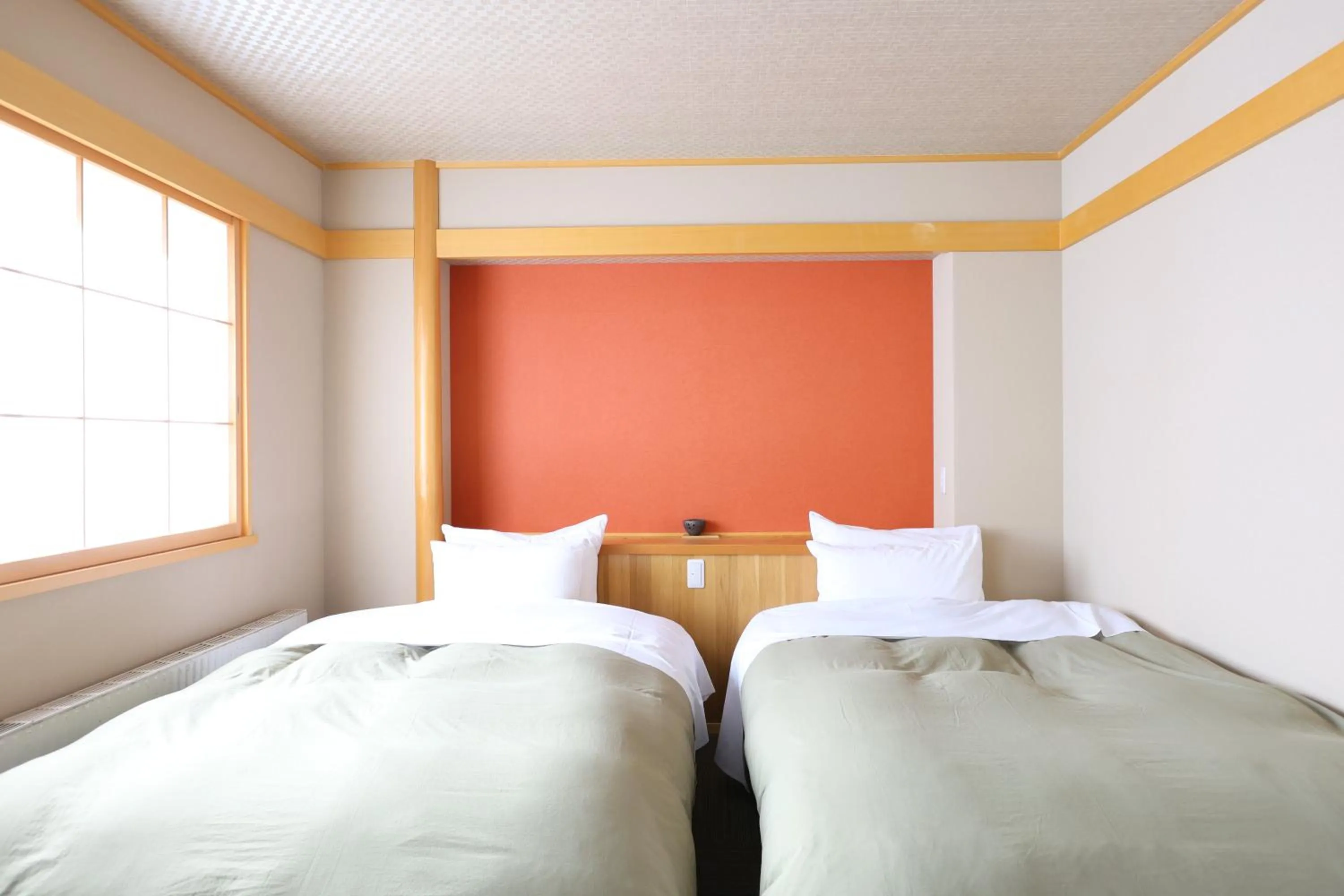 Bed in Hotel Takimoto