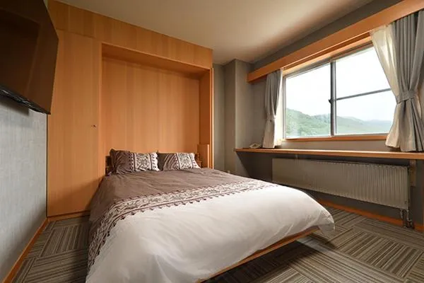 Bed in Hotel Takimoto