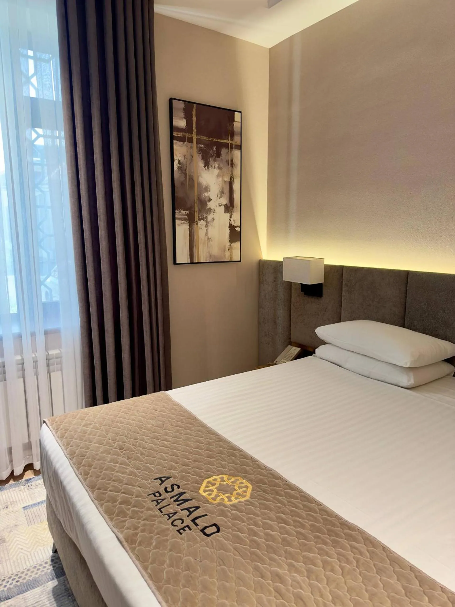 Bed in Asmald Palace Hotel