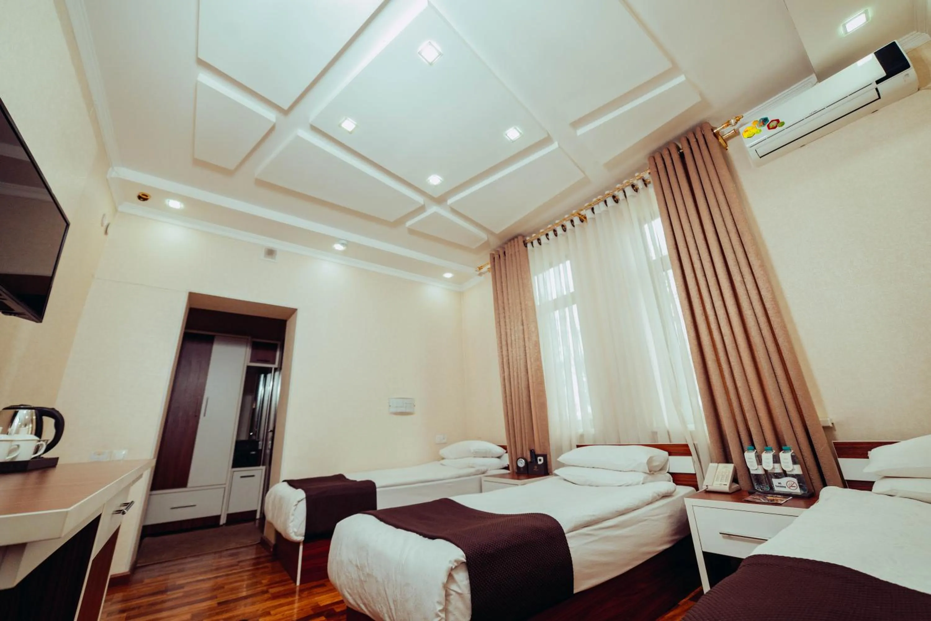 Bed in Asmald Palace Hotel