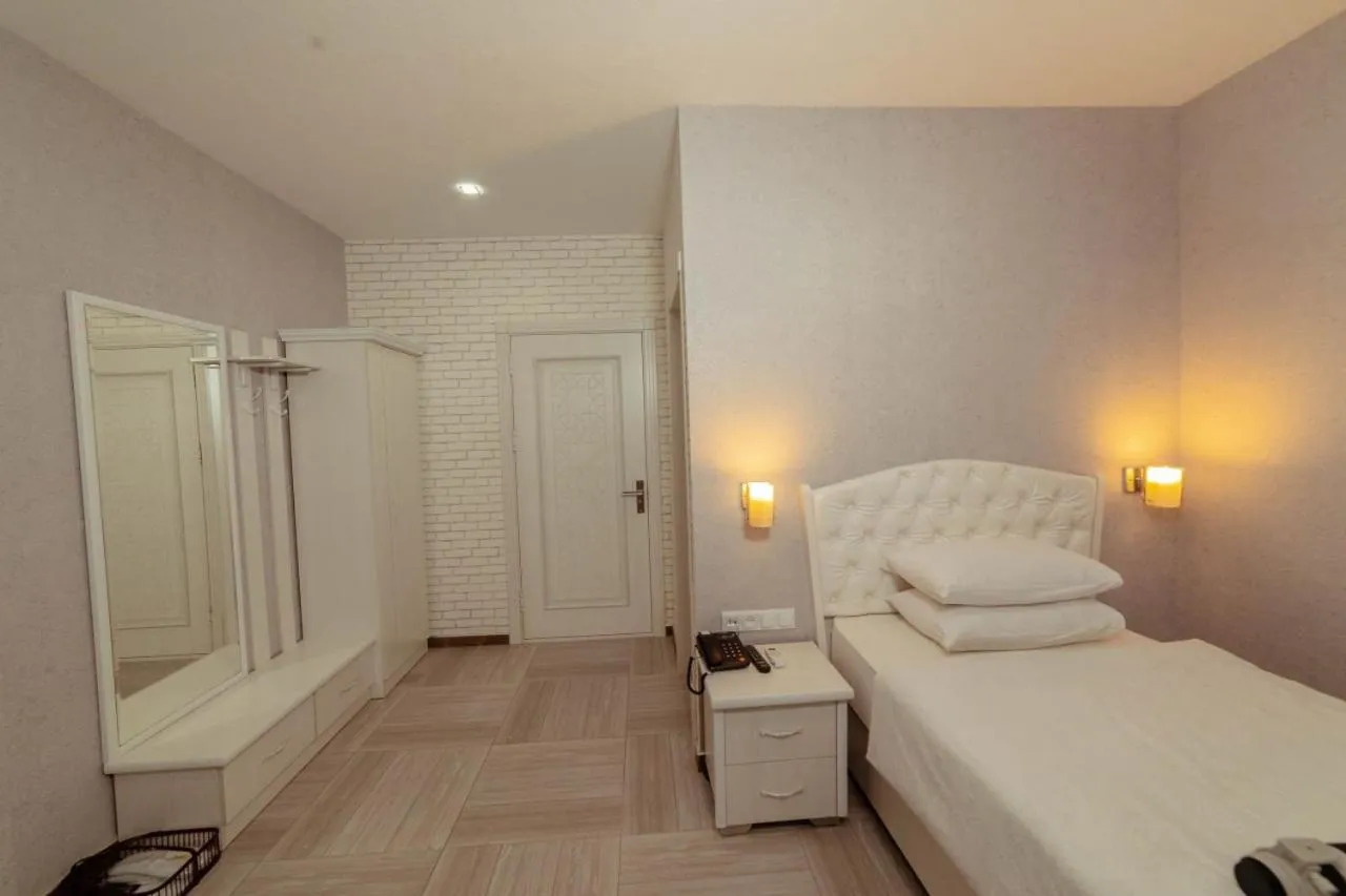 Bed in Asmald Palace Hotel