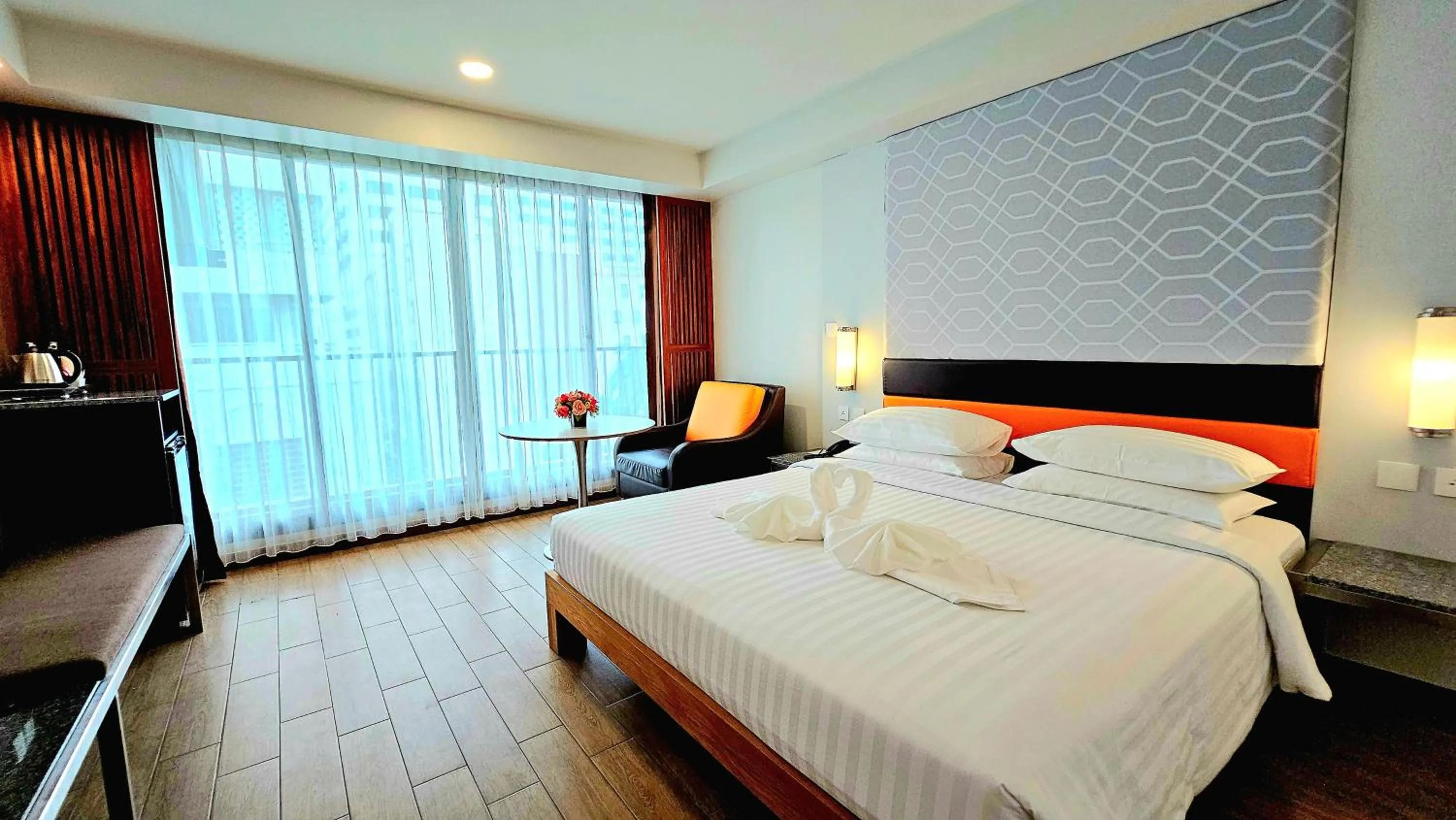 Bed in Dynasty Grande Hotel