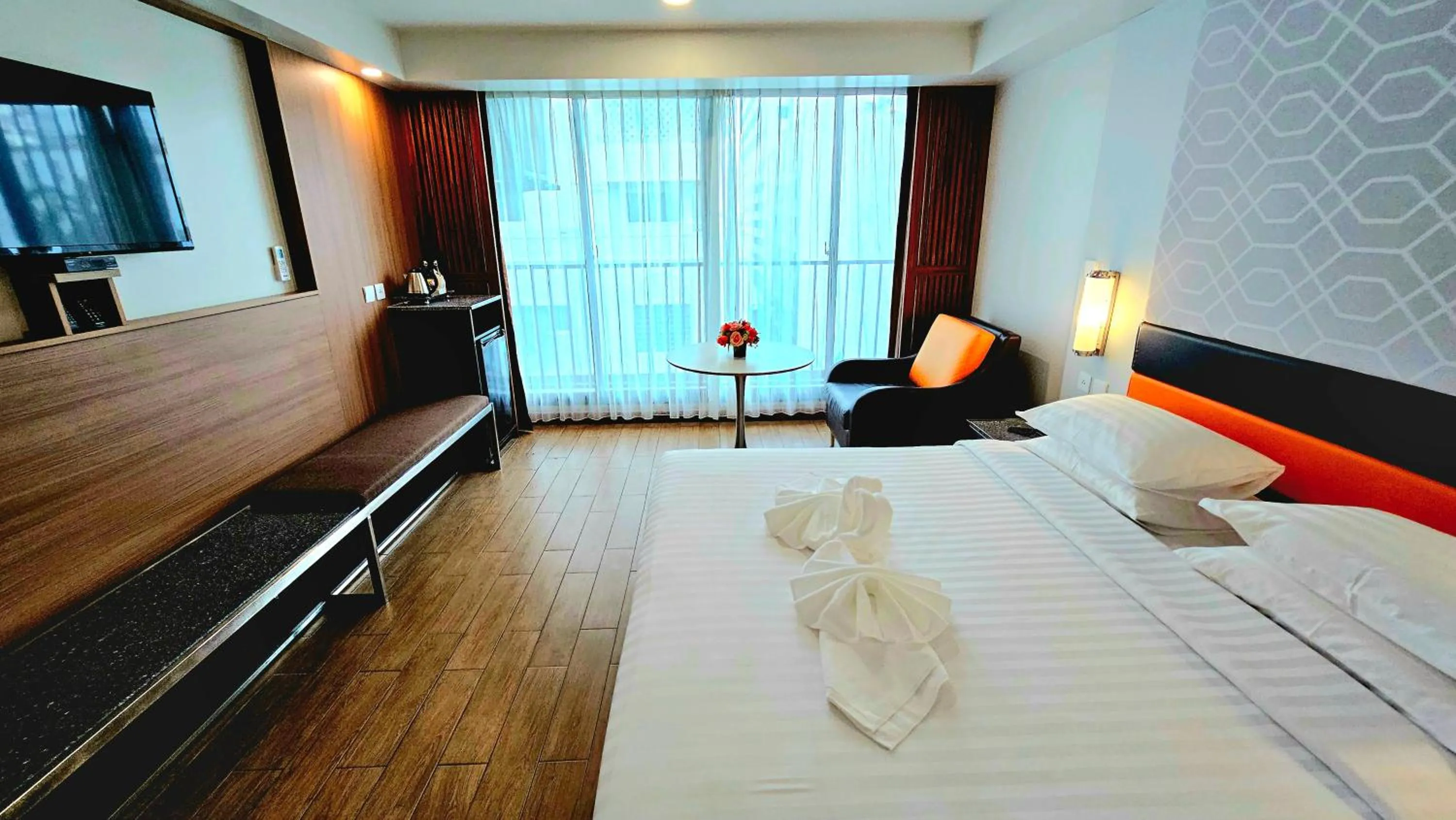 Bed in Dynasty Grande Hotel