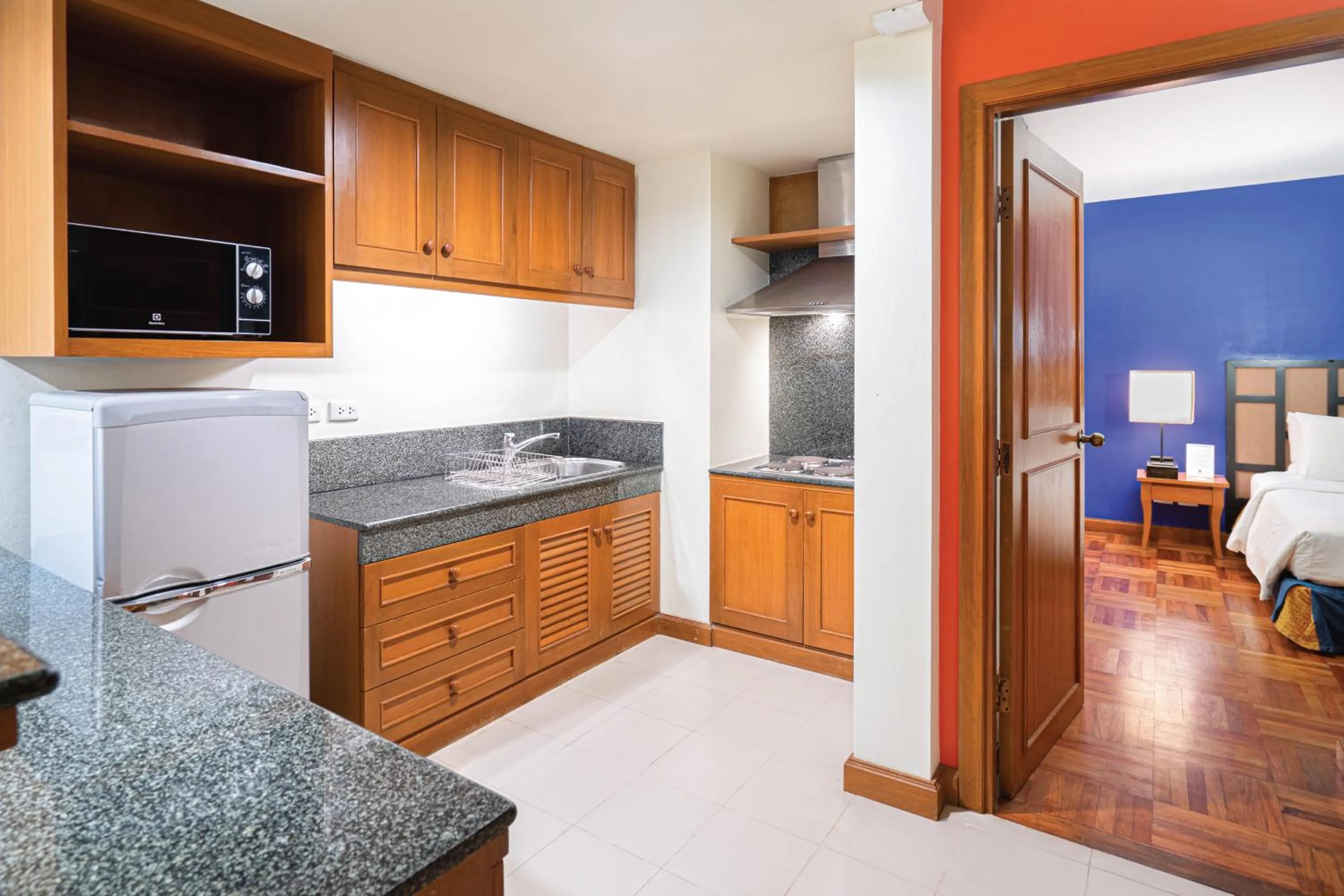Kitchen or kitchenette, Bed in Homm Suites Laguna, part of Banyan Group