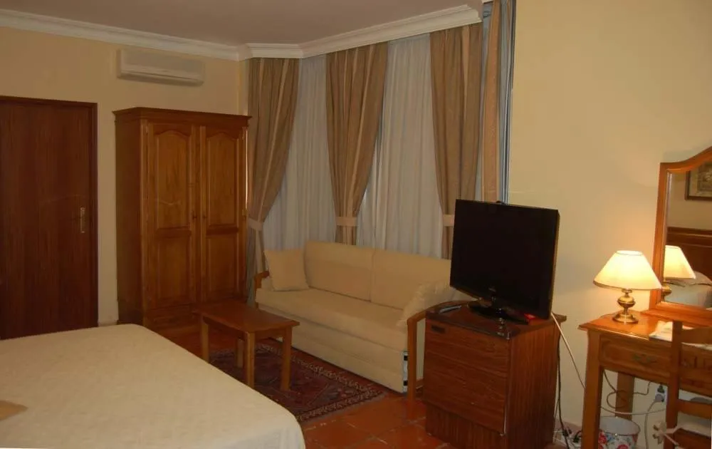 Living room, Bed in Hotel Jardim