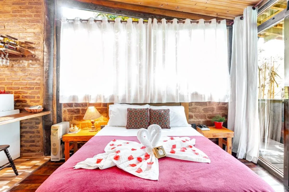 Bed in Chalé Rustic House