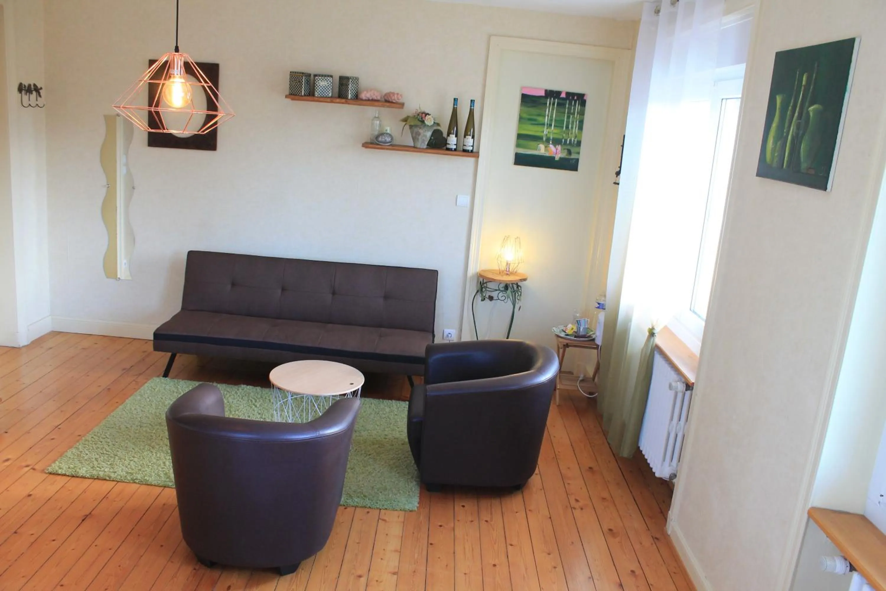 Seating area in Aux Berges de la Thur