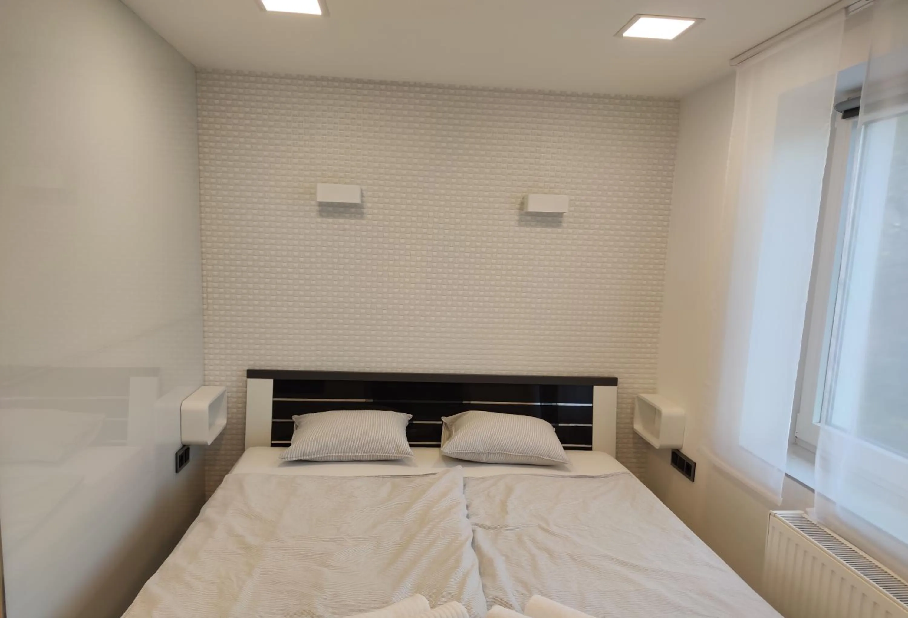 Bed in AQUA SOLAR APARTMANHÁZ