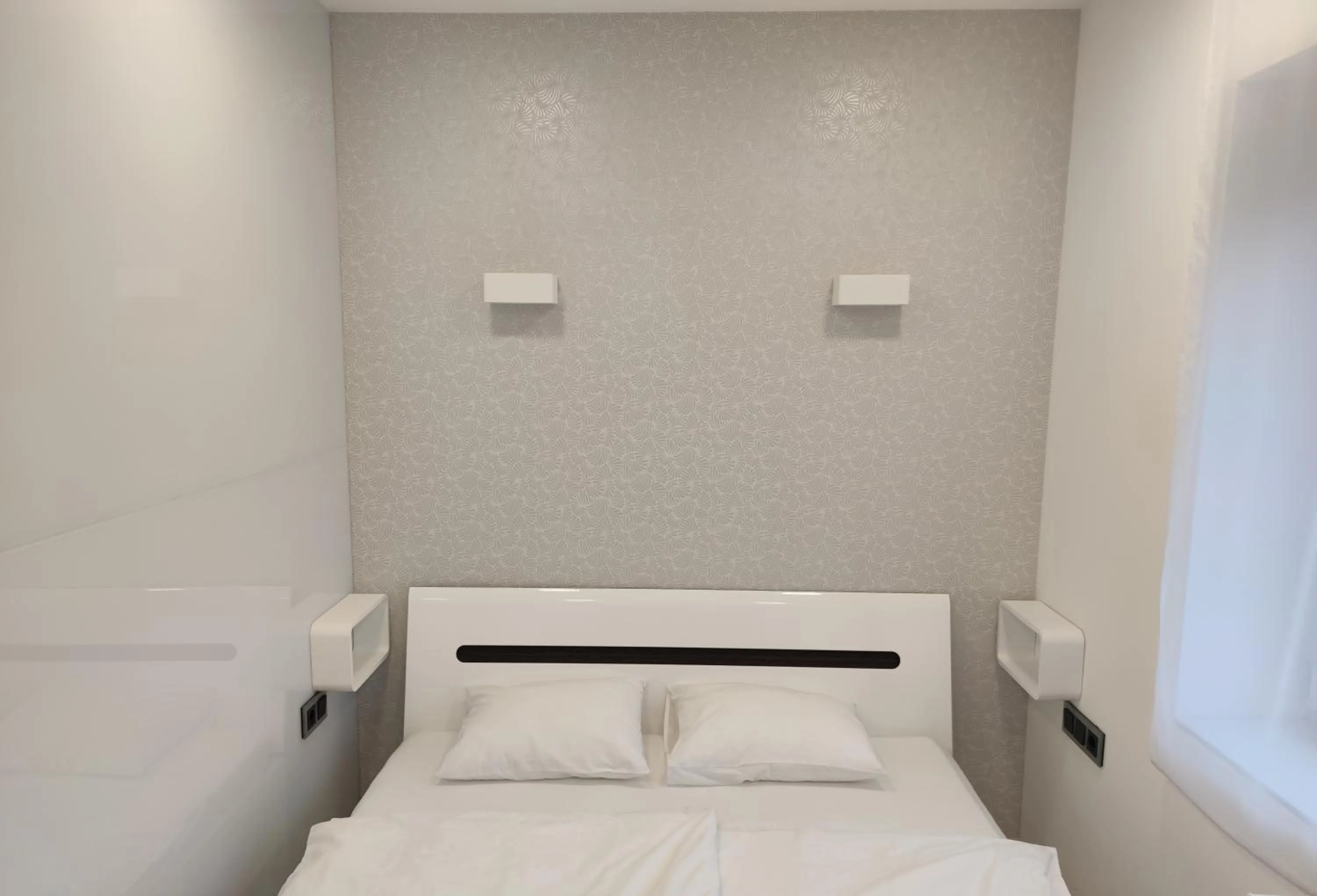 Bed in AQUA SOLAR APARTMANHÁZ