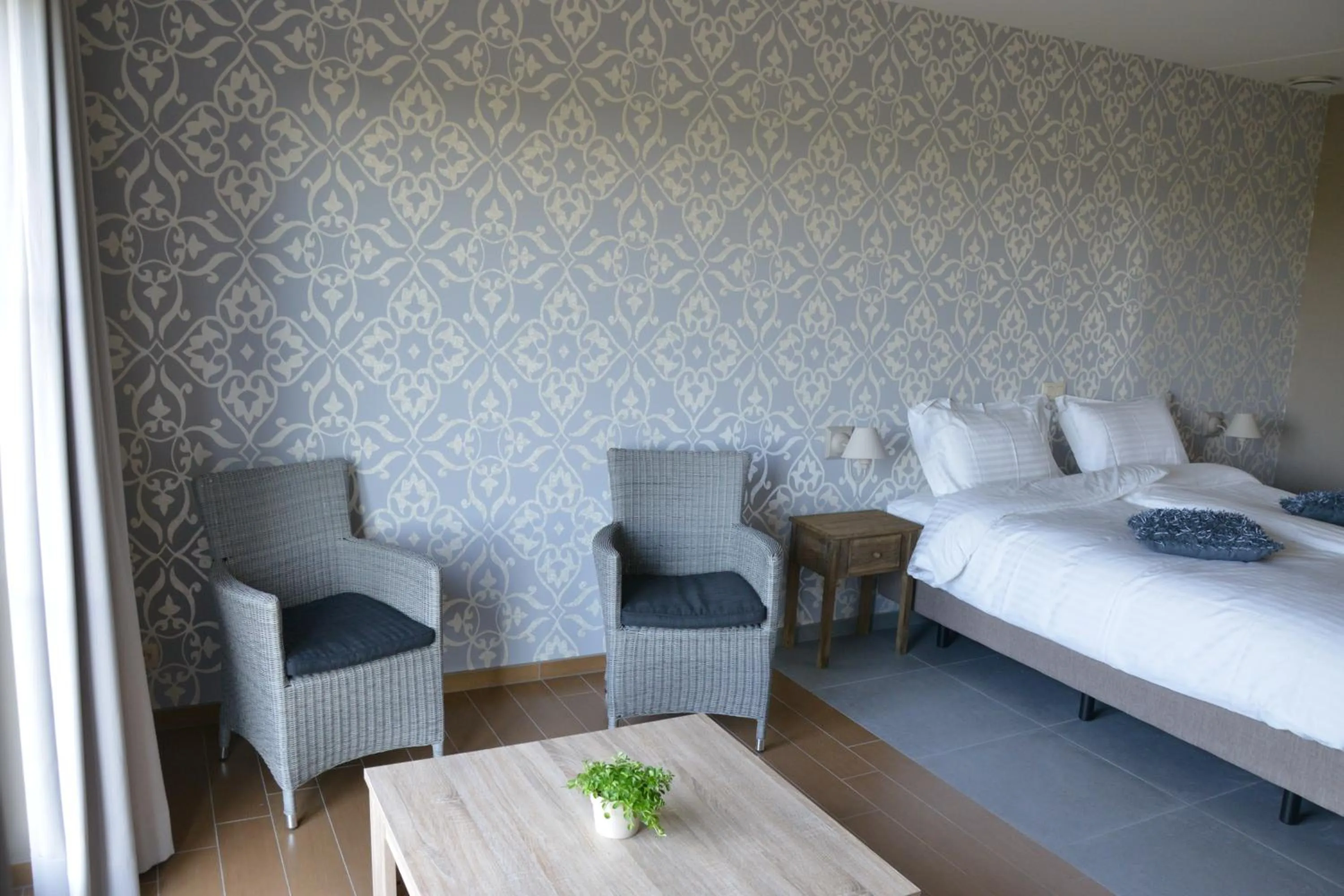Seating area, Bed in B&B Nieuwhof