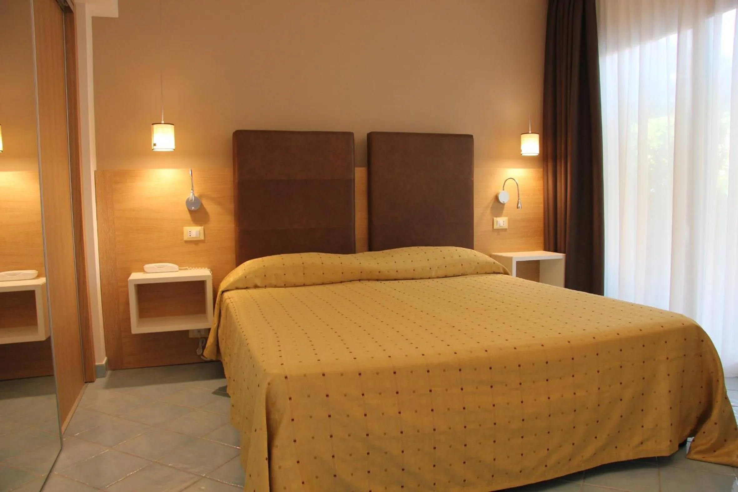 Bed in Baia del Godano Resort & Spa