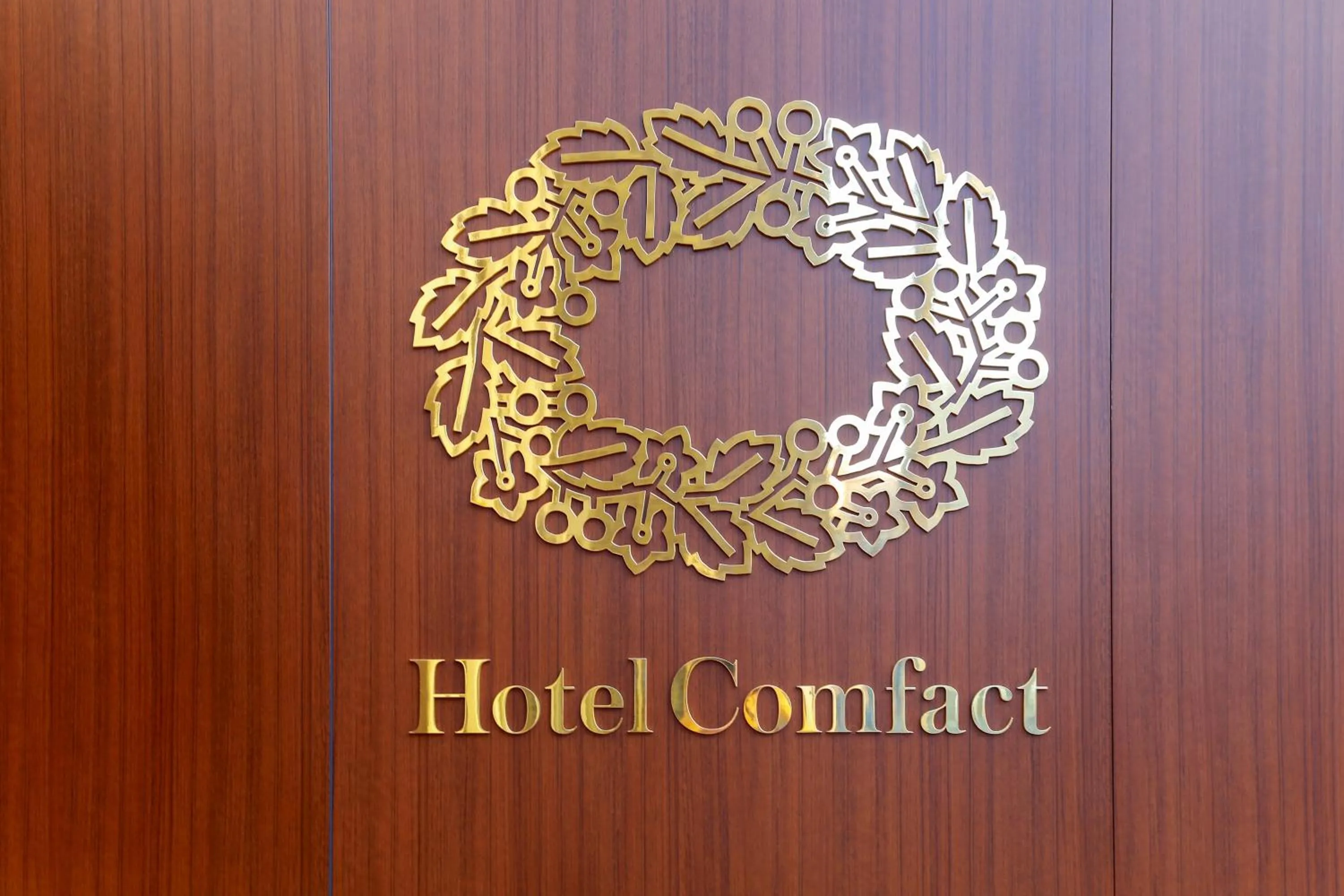 Property logo or sign in Hotel Comfact
