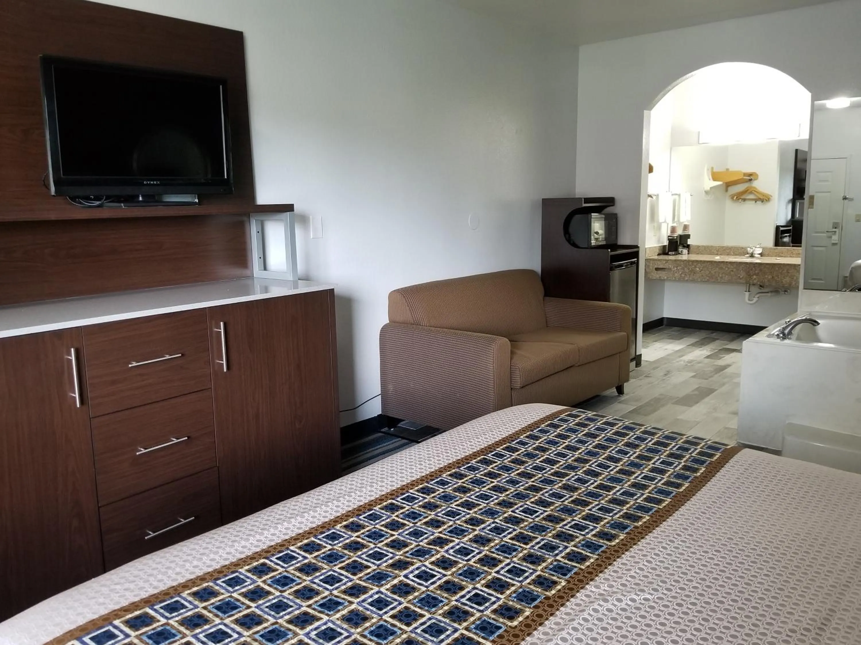 Bed in HomeBridge Inn and Suites