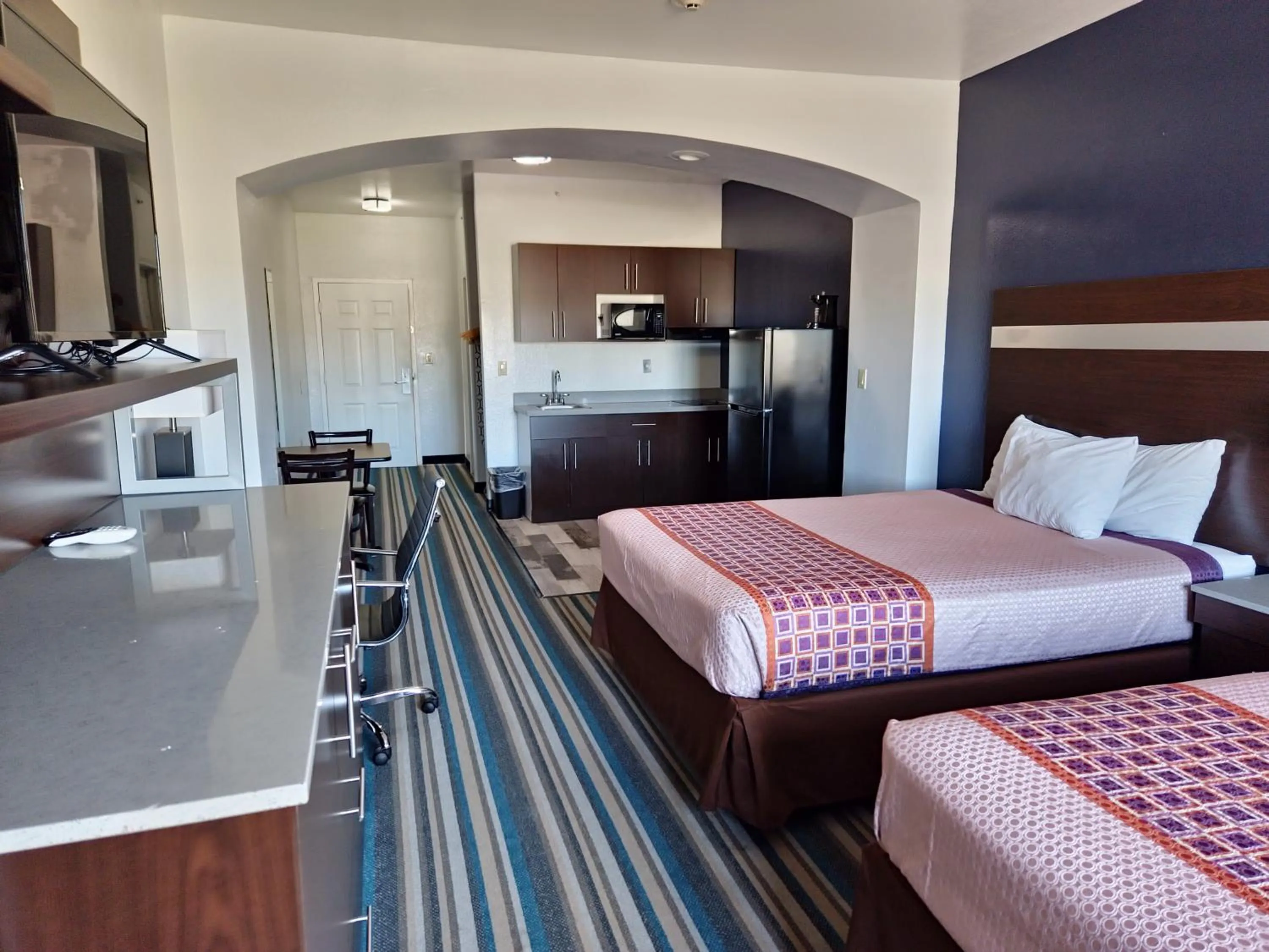 Bed in HomeBridge Inn and Suites