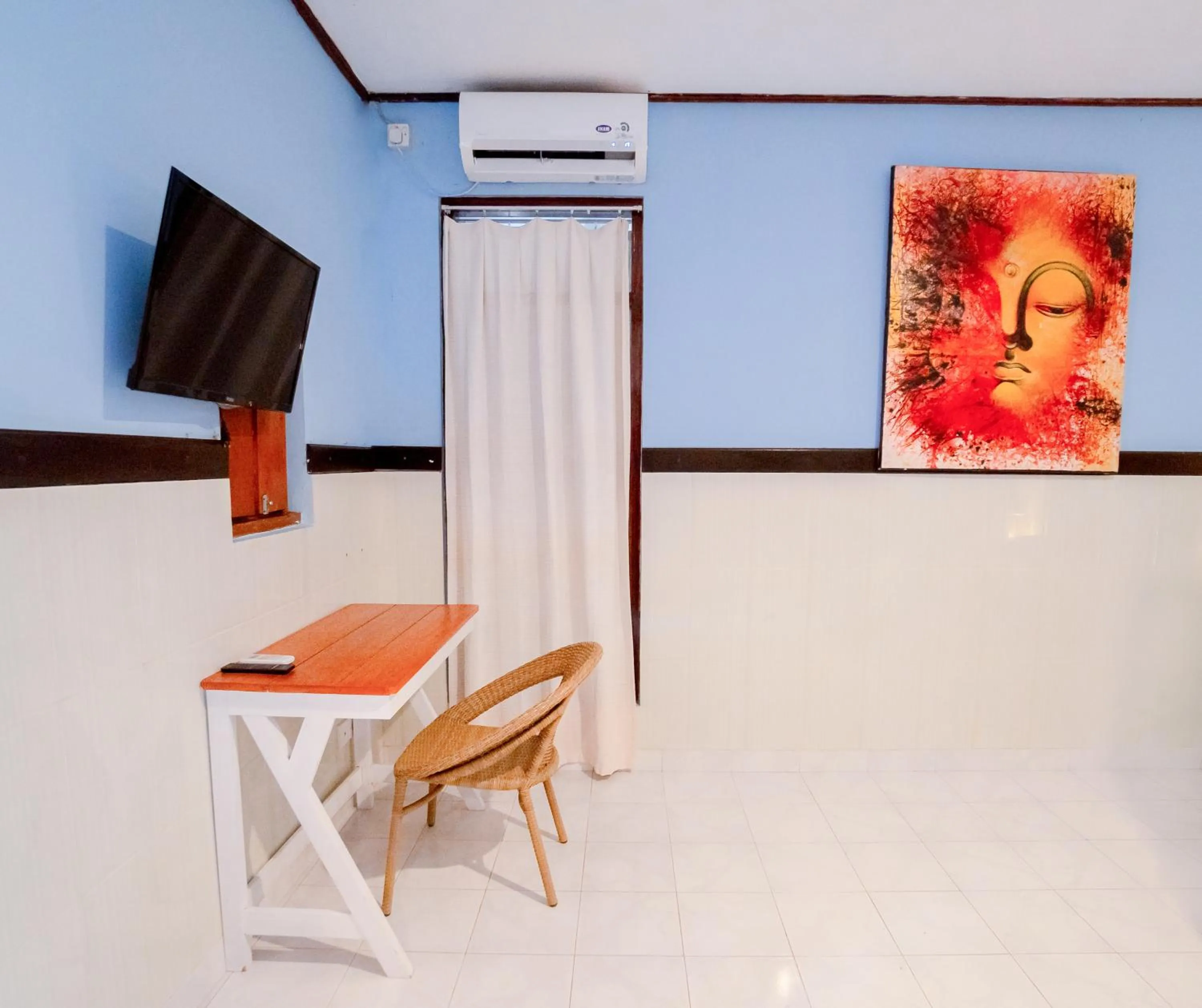 Communal lounge/ TV room in The Guest Villas Legian Kuta