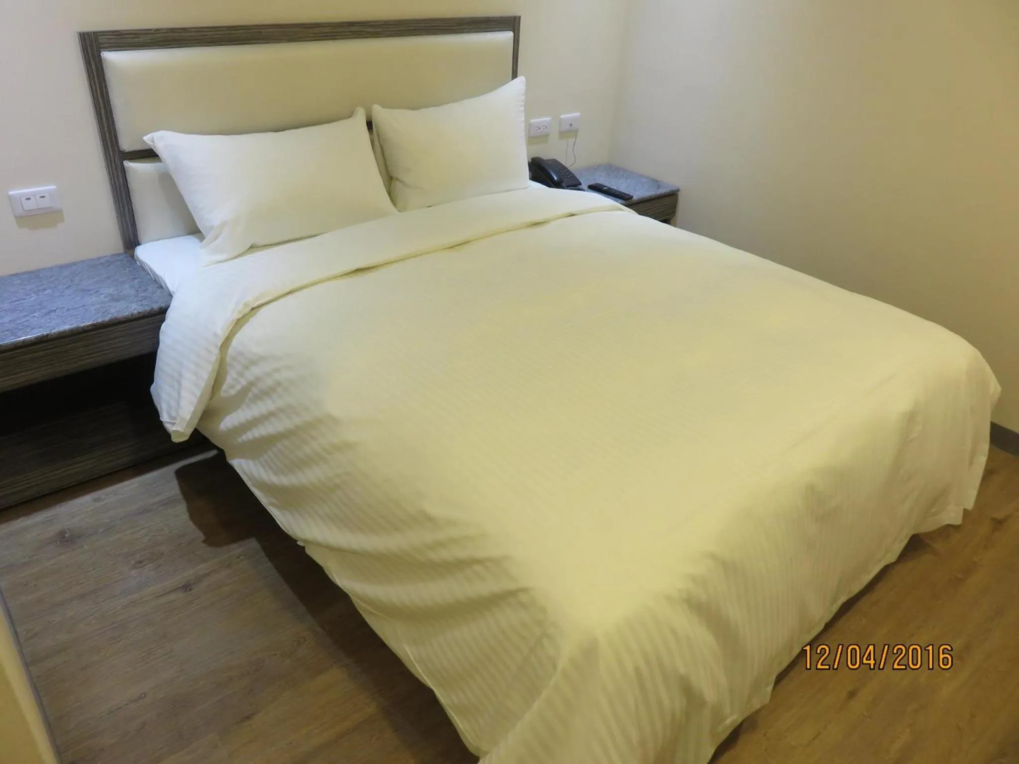 Bed in Mao Hua Motel