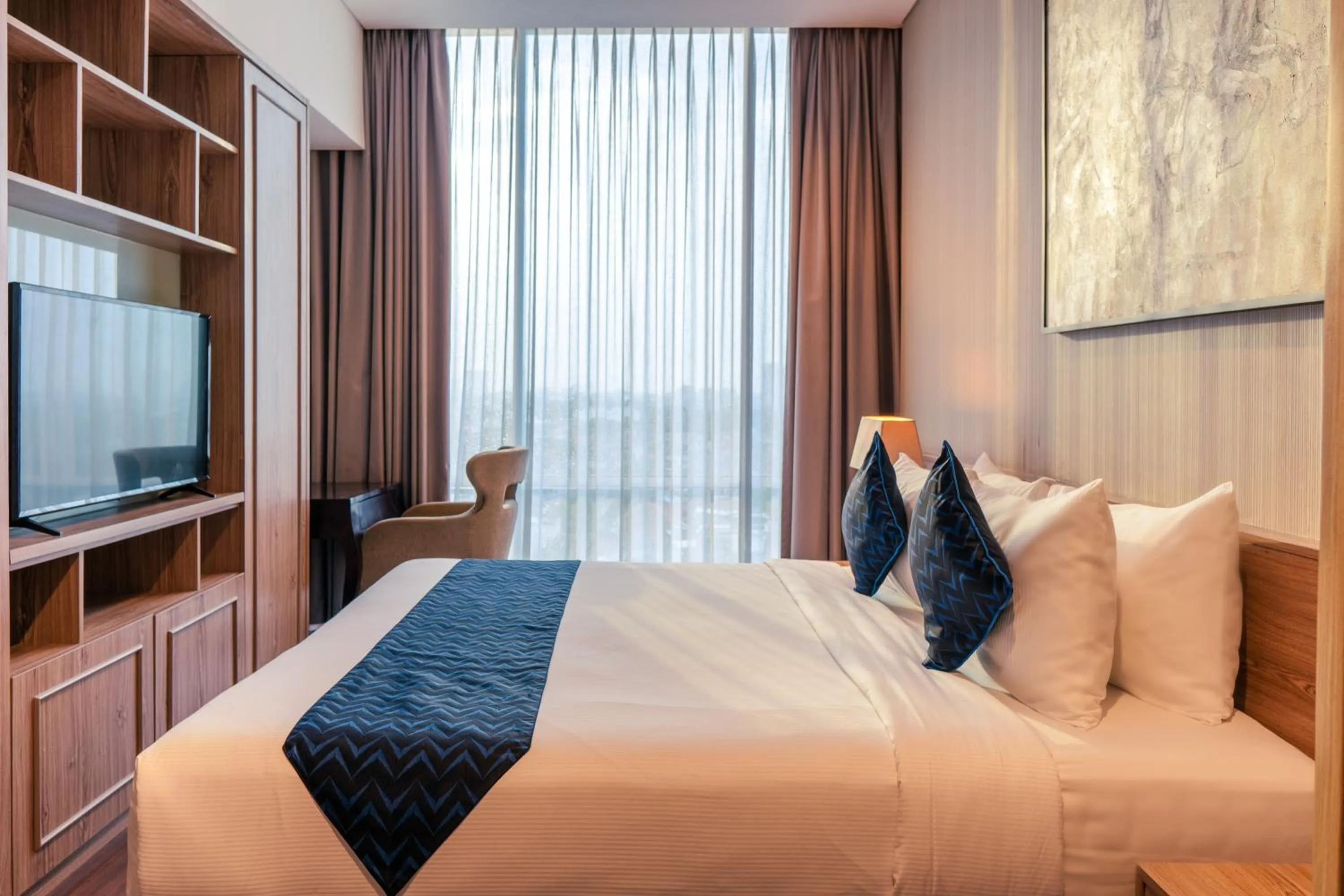 Bed in Azana Suites Hotel Antasari