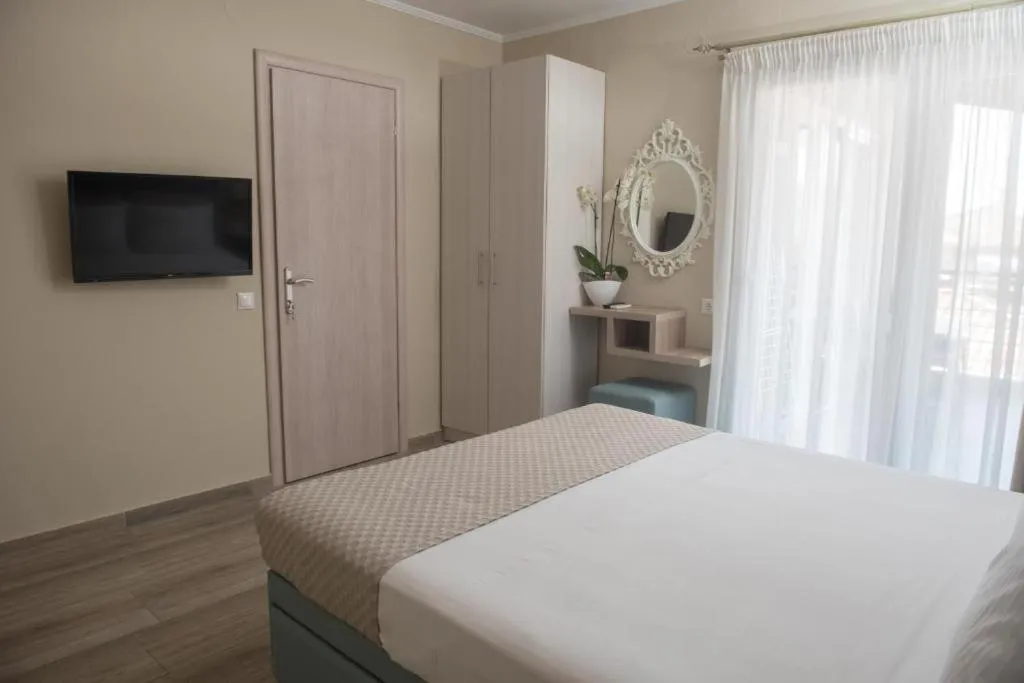 Photo of the whole room, Bed in Ammos Beach Seaside Luxury Suites Hotel
