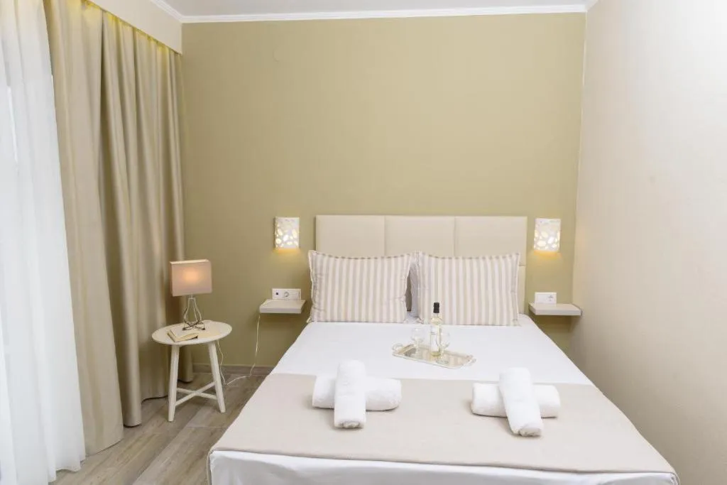 Photo of the whole room, Bed in Ammos Beach Seaside Luxury Suites Hotel