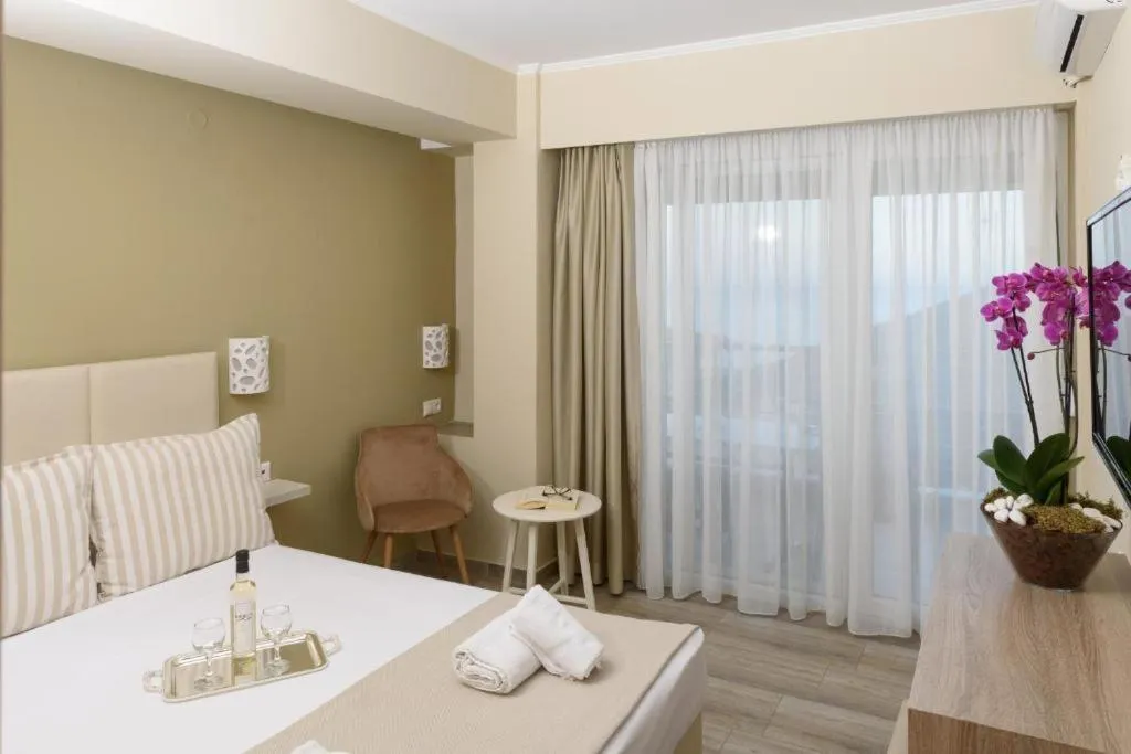 Photo of the whole room, Bed in Ammos Beach Seaside Luxury Suites Hotel