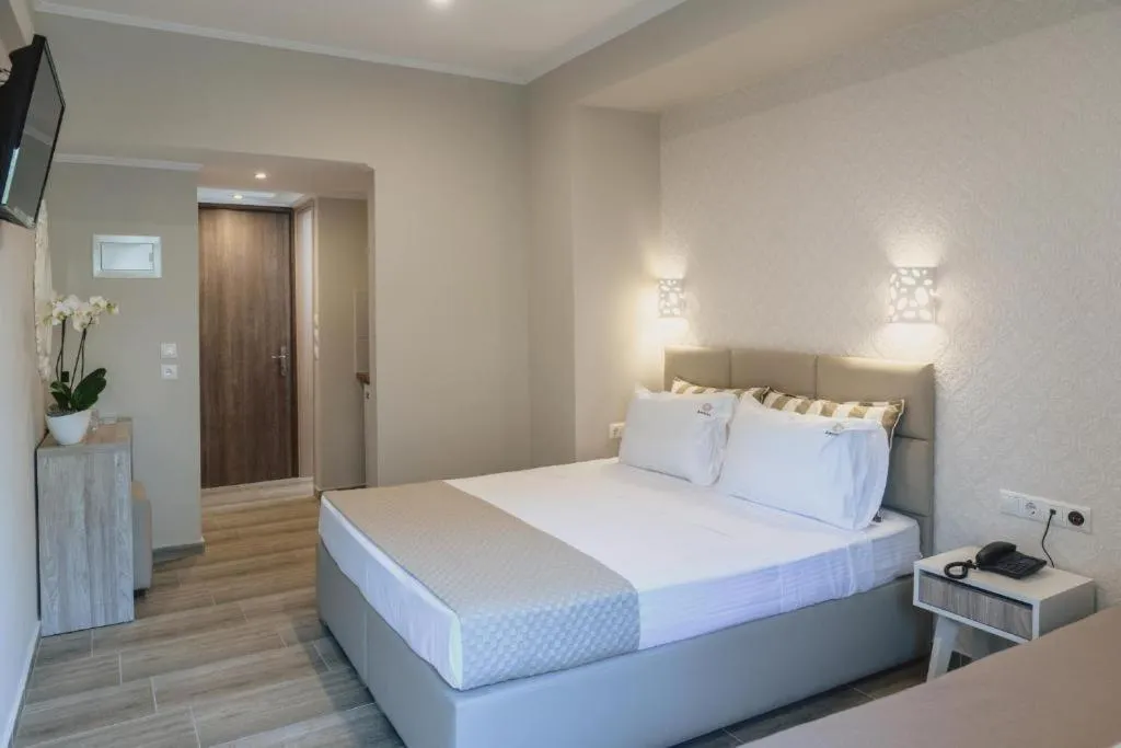 Photo of the whole room, Bed in Ammos Beach Seaside Luxury Suites Hotel