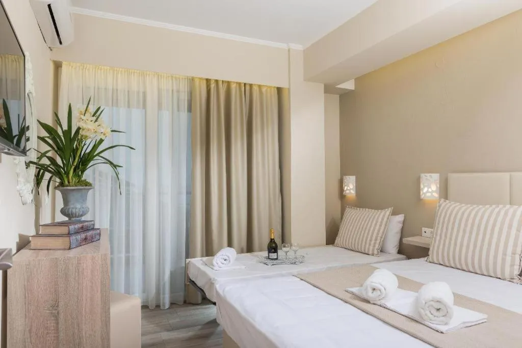 Photo of the whole room, Bed in Ammos Beach Seaside Luxury Suites Hotel
