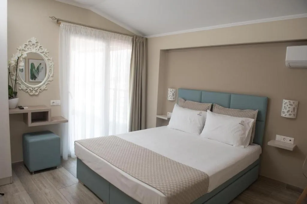 Photo of the whole room, Bed in Ammos Beach Seaside Luxury Suites Hotel