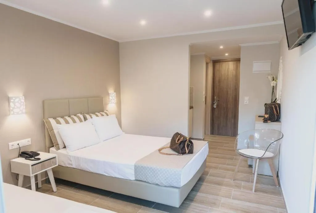 Photo of the whole room, Bed in Ammos Beach Seaside Luxury Suites Hotel