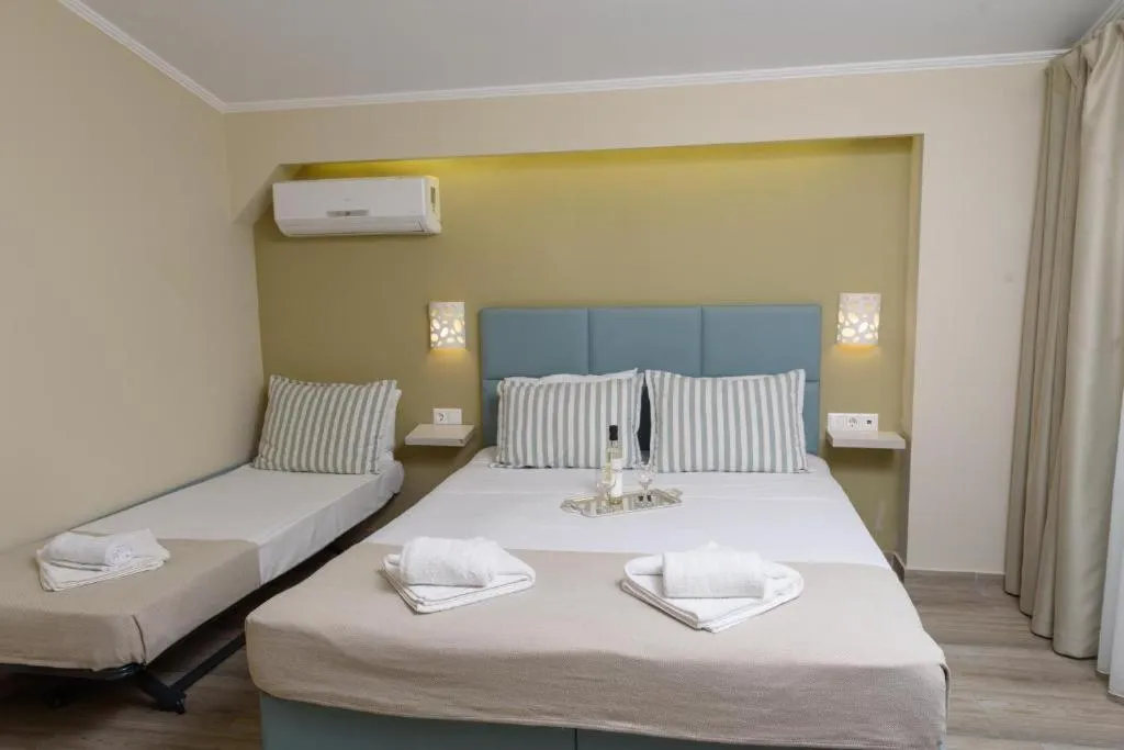 Photo of the whole room, Bed in Ammos Beach Seaside Luxury Suites Hotel