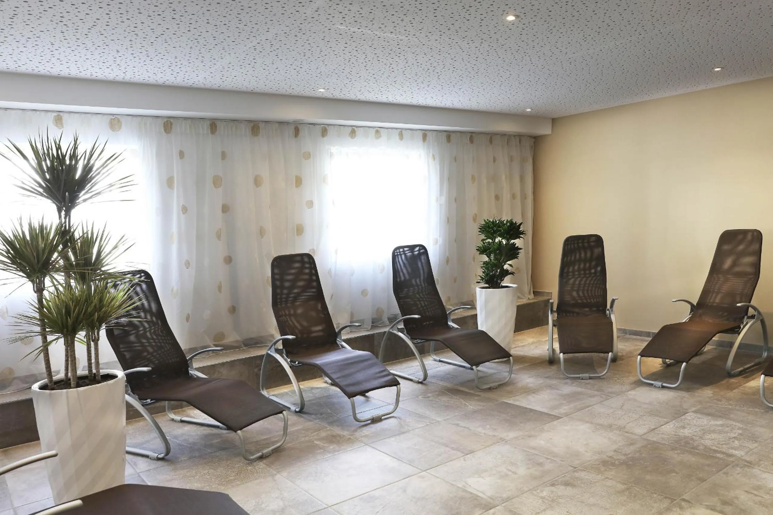Seating area in Tauernsuites Mitterwirt by ALPS RESORTS