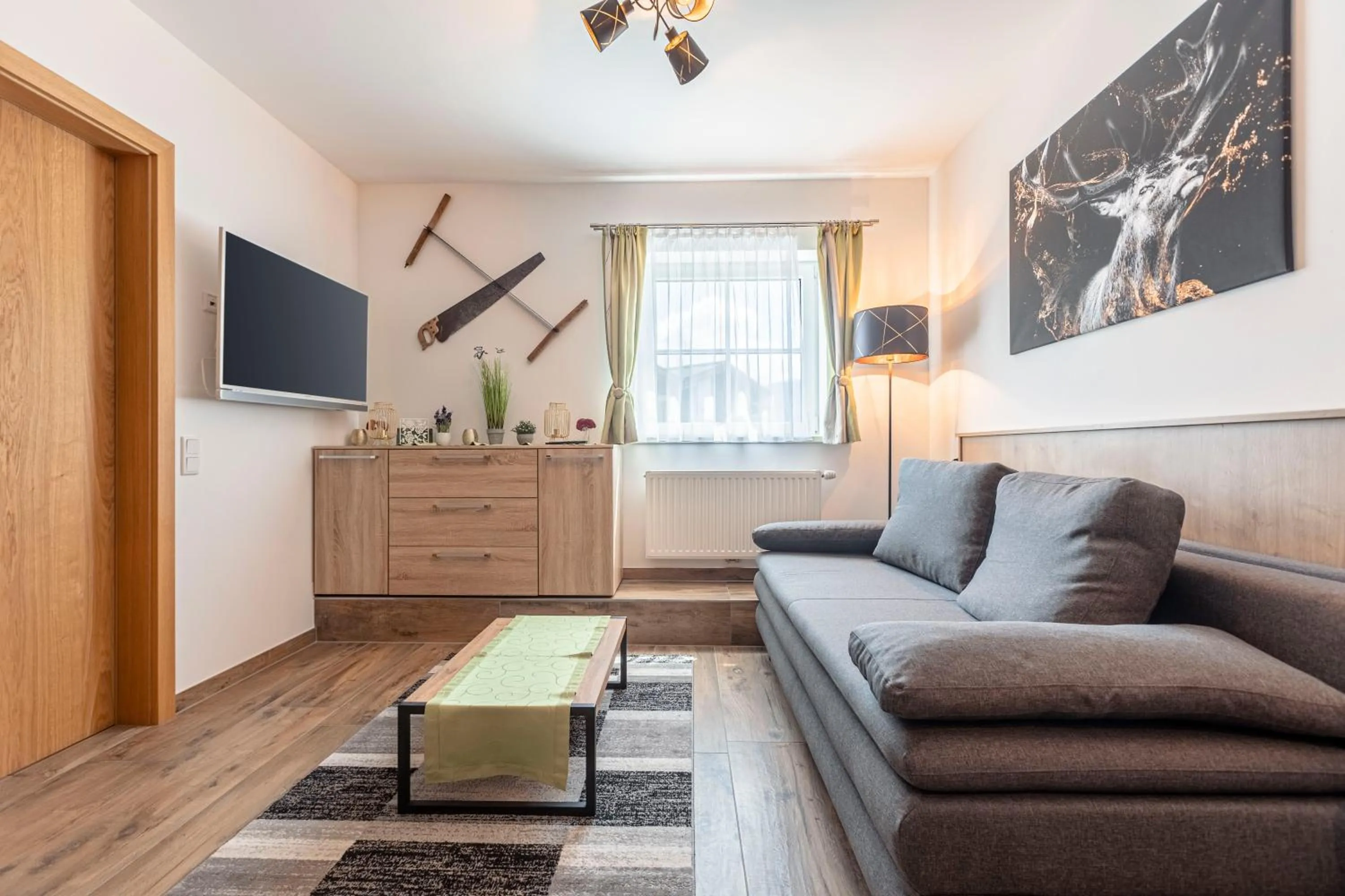 Living room in Tauernsuites Mitterwirt by ALPS RESORTS