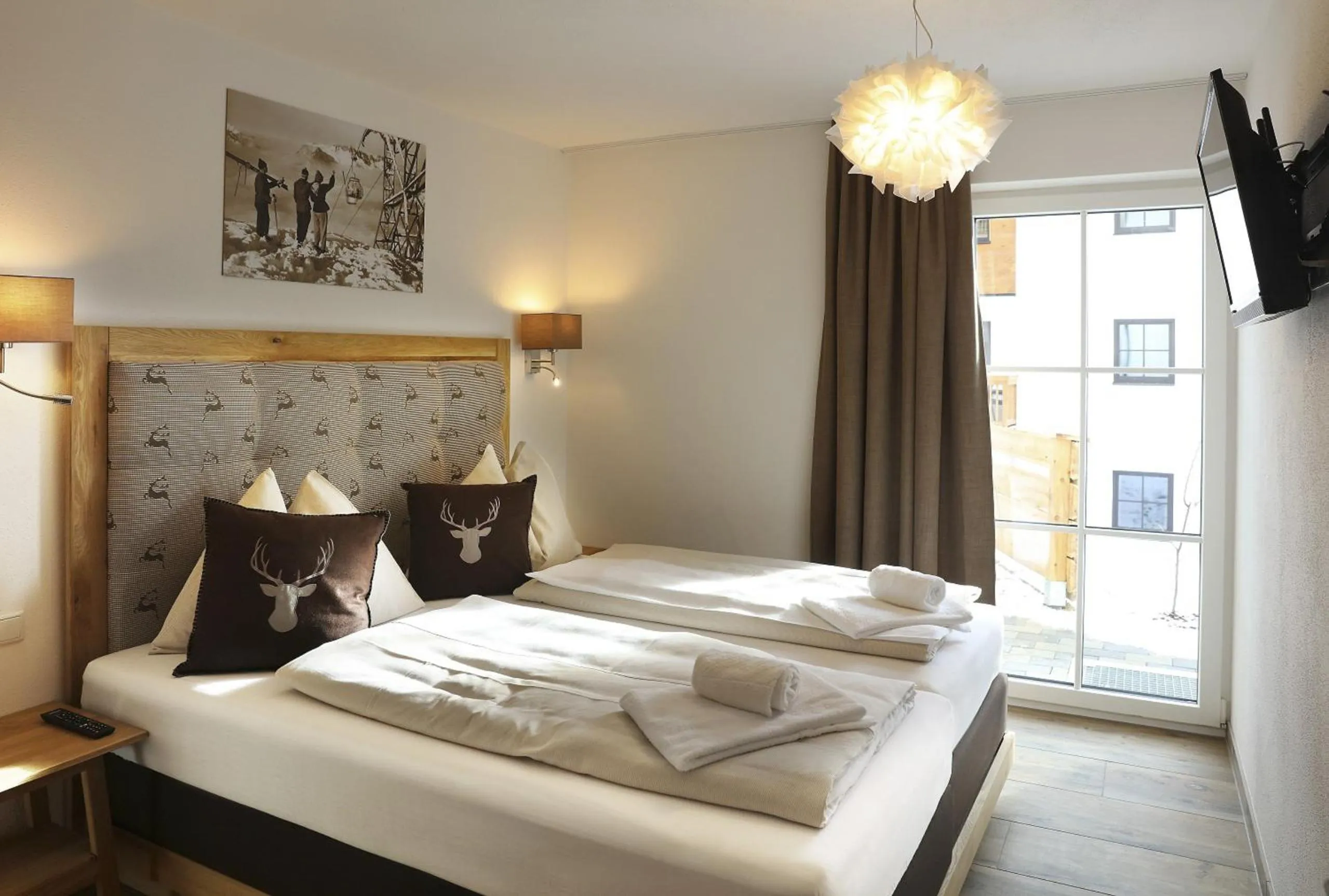 Bed in Tauernsuites Mitterwirt by ALPS RESORTS