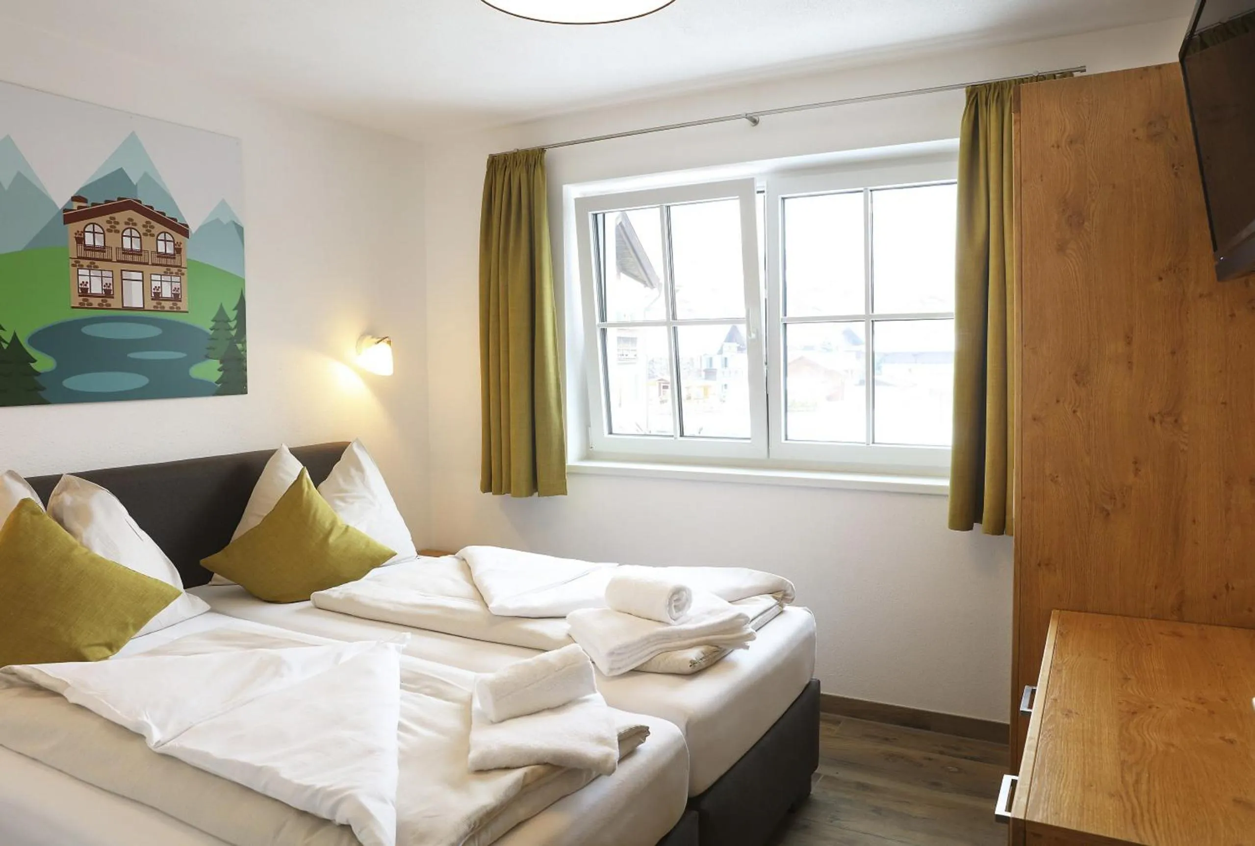 Bed in Tauernsuites Mitterwirt by ALPS RESORTS