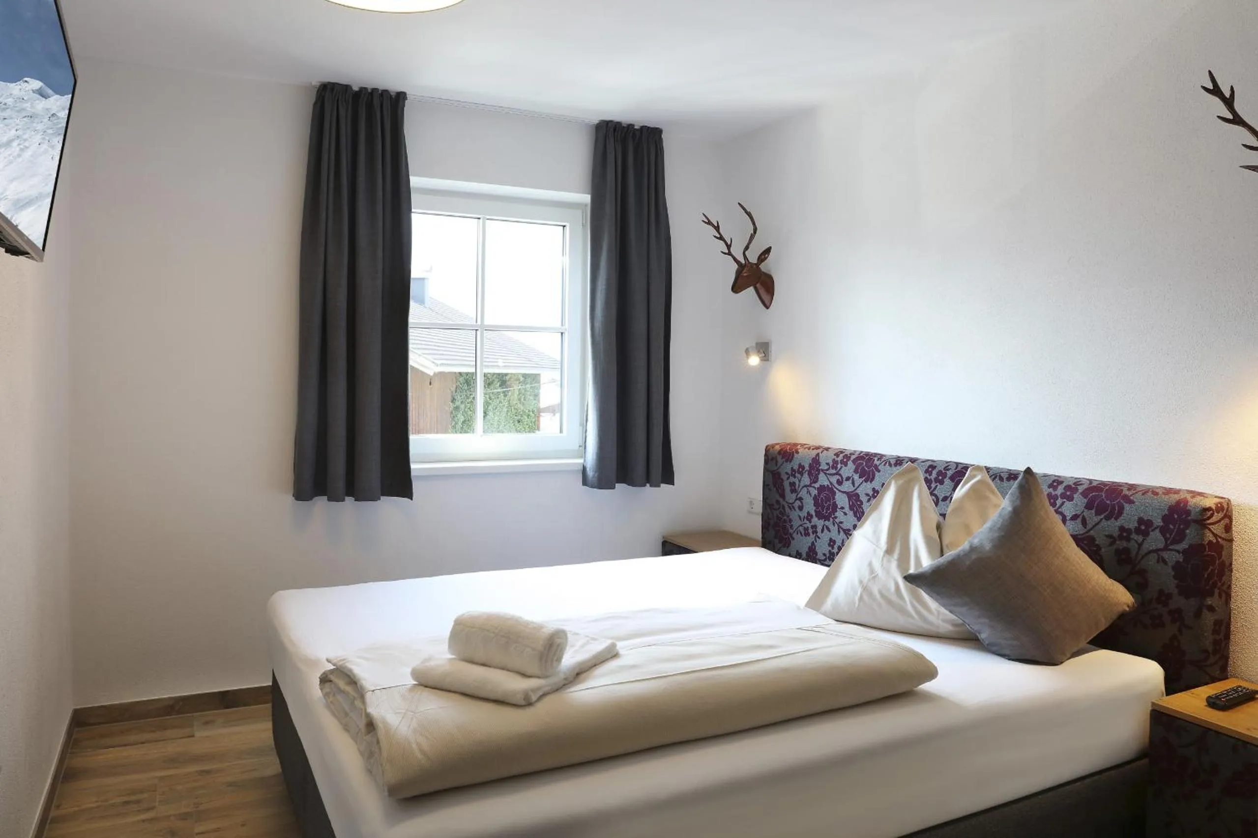 Bed in Tauernsuites Mitterwirt by ALPS RESORTS