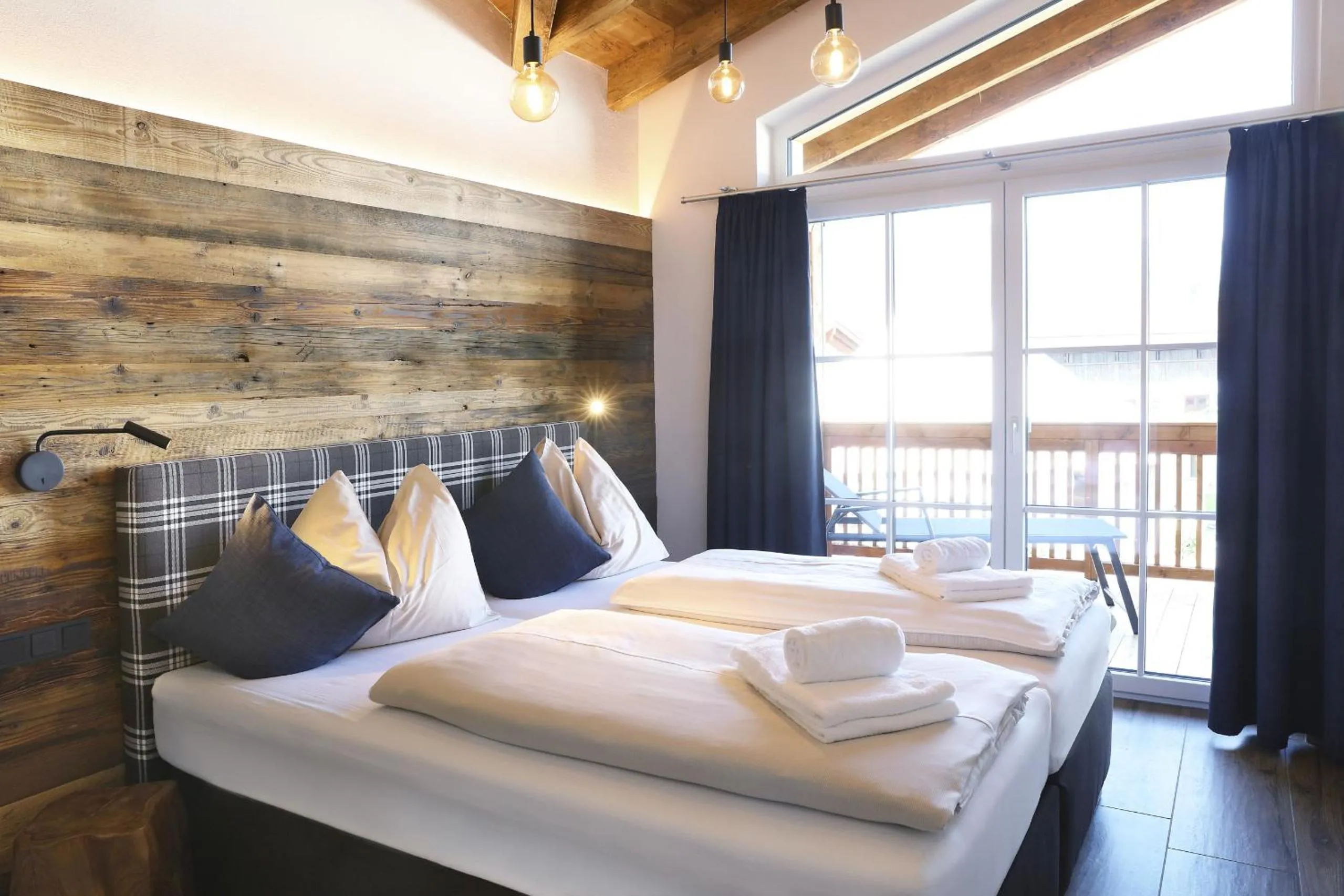 Bed in Tauernsuites Mitterwirt by ALPS RESORTS
