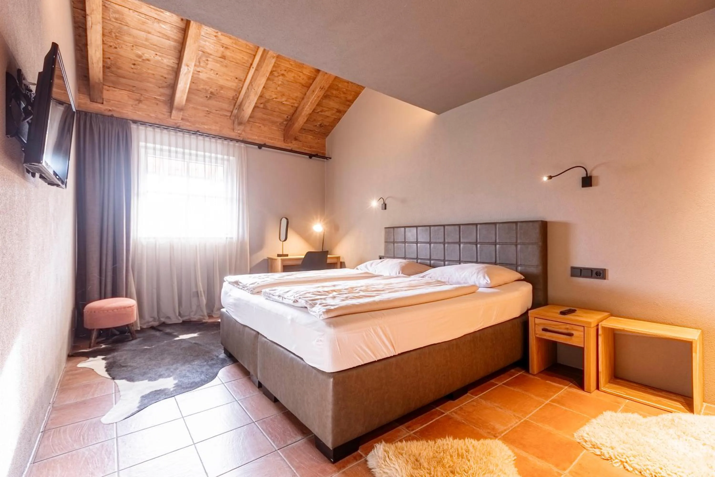Bed in Tauernsuites Mitterwirt by ALPS RESORTS