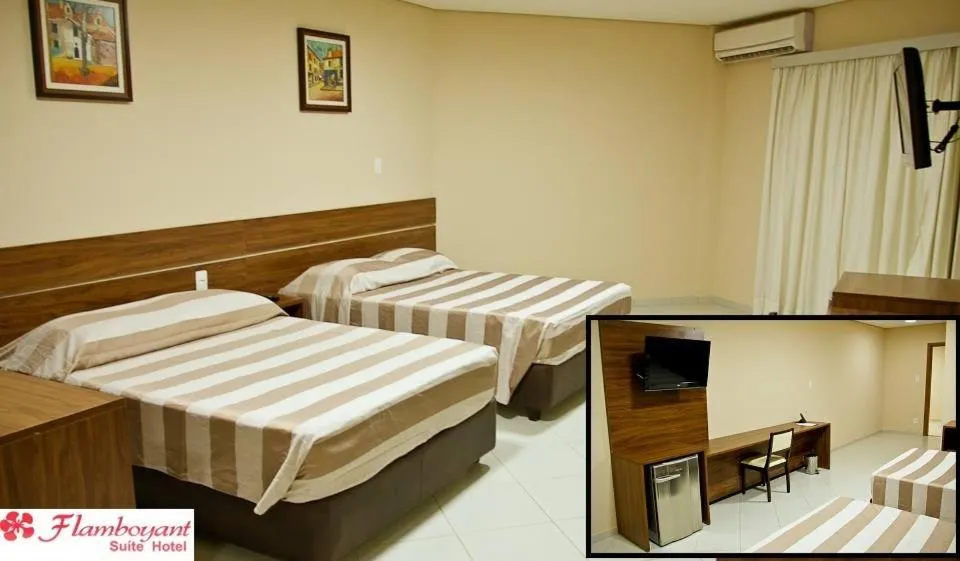 Bed in Flamboyant Suite Hotel