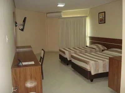 Bed in Flamboyant Suite Hotel