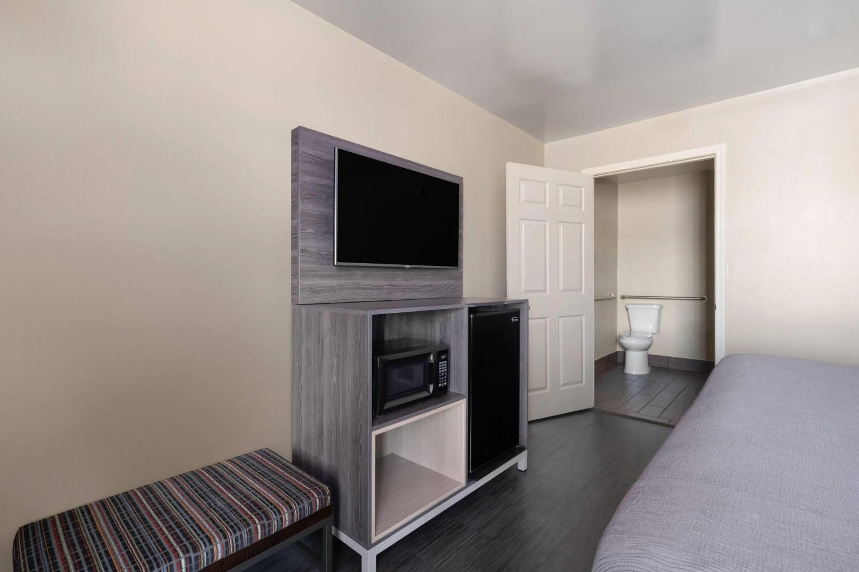 Photo of the whole room, Bed in Baymont by Wyndham Commerce GA Near Tanger Outlets Mall