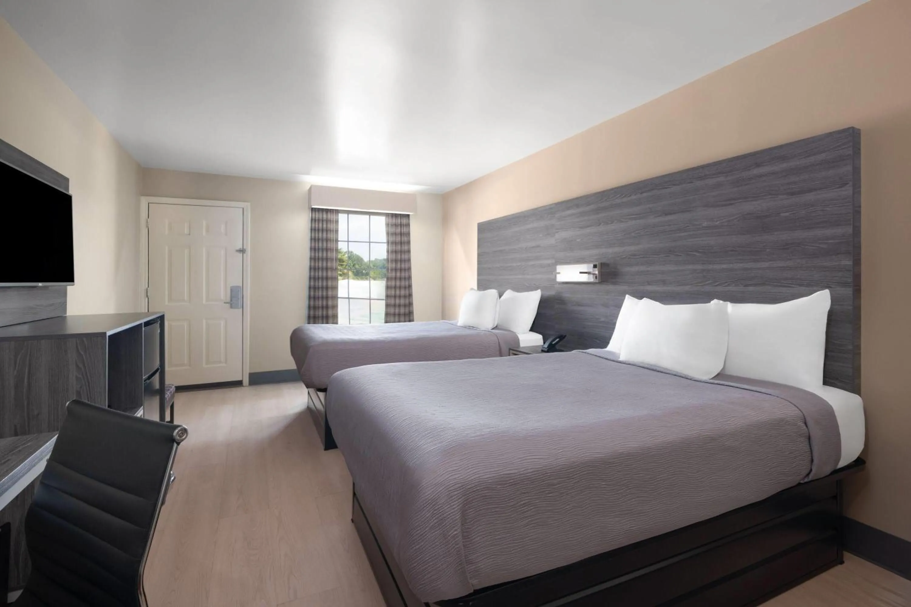 Photo of the whole room, Bed in Baymont by Wyndham Commerce GA Near Tanger Outlets Mall