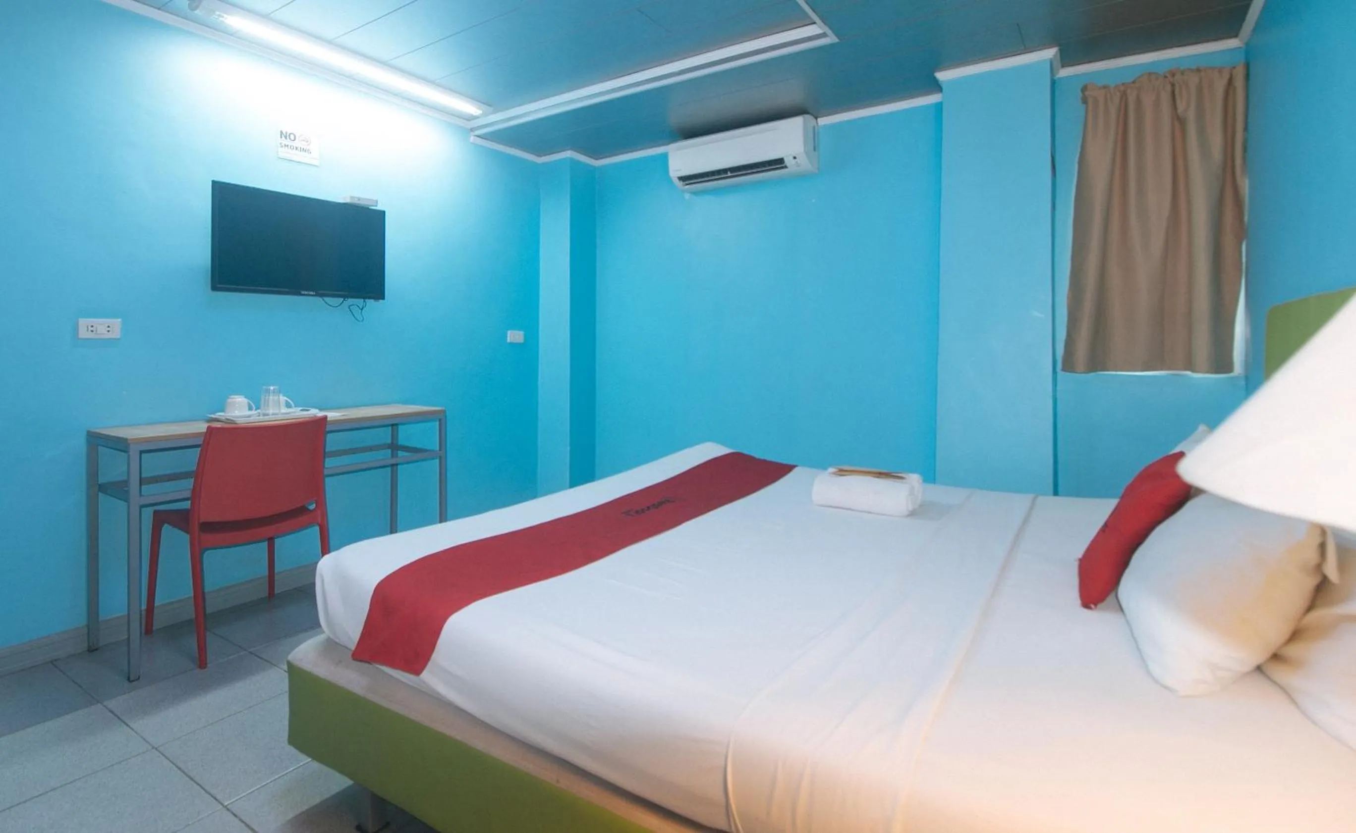 TV and multimedia, Bed in RedDoorz Plus New Era Budget Hotel Mandaue former RedDoorz Plus near UV Mandaue Cebu