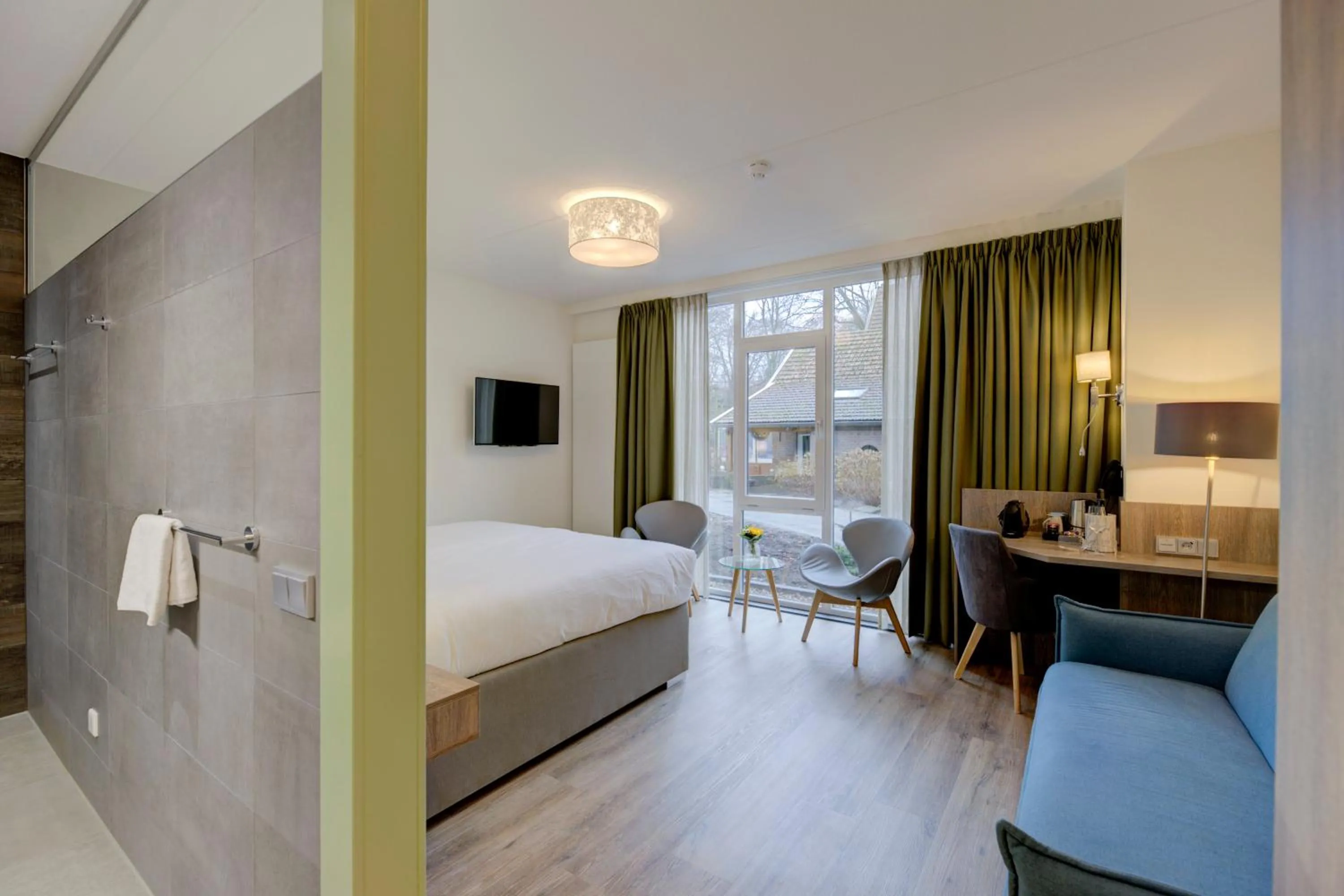 Living room, Bed in Hotel Erve Hulsbeek