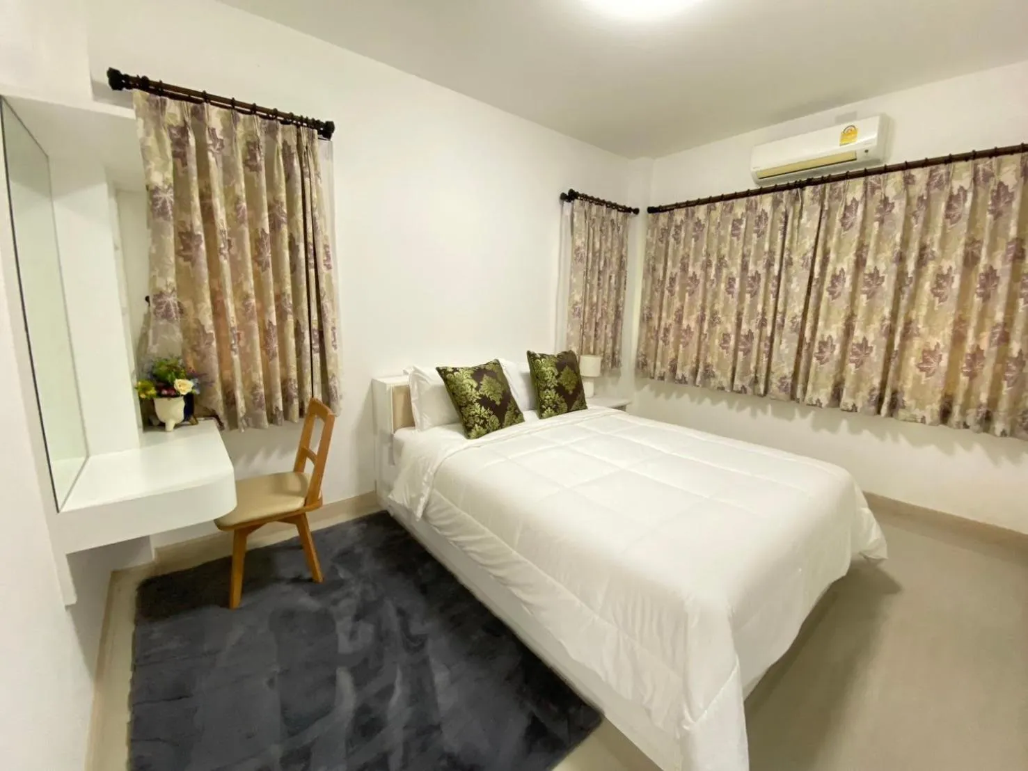 Bed in Baan Pingkan Wellness Resort